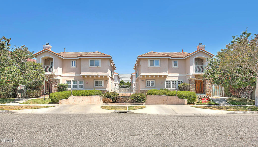 Welcome to this beautifully updated end-unit Spanish townhome, ideally located just one block from Main Street and Marengo Avenue in the heart of Alhambra. Offering both timeless charm and modern updates, this residence is a rare gem.Step inside to discover a bright, airy interior with natural light streaming through large windows. The living room features rich laminate wood flooring and brand-new recessed lighting. The spacious, open-concept kitchen is a chef's delight, complete with quartz countertops, new stainless steel stove, updated sink and fixtures, modern ceiling light, and a stylish chandelier over the adjacent dining area.The highly sought-after layout includes a main-floor bedroom--perfect for guests or a home office--and an updated full bath with a new white Carrera marble vanity, fresh fixtures, lighting, mirror, shower head, and toilet. A dramatic contemporary gold chandelier adds a designer touch to the stairwell.Upstairs, you'll find two generous primary suites, each with new ceiling lighting. The larger suite includes a private balcony and a custom-lit walk-in closet. Its en-suite bath has been tastefully remodeled with a double vanity featuring quartz counters, updated fixtures, mirrors, lighting, shower head, and toilet. The second suite also includes an upgraded private bath with new vanity, lighting, fixtures, and toilet.Additional features include a large laundry room, an expansive private garage with extra storage and new lighting, plus an additional carport space for a total of three dedicated parking spots. The home has been freshly painted throughout, with new carpeting and modern silver hardware completing the turnkey feel.With a Walk Score of 77, you're minutes from Target, Costco, Aldi, Alhambra Park, and top dining spots. This exceptional home offers refined living in a prime location--schedule your private tour today and experience the best of Alhambra living.