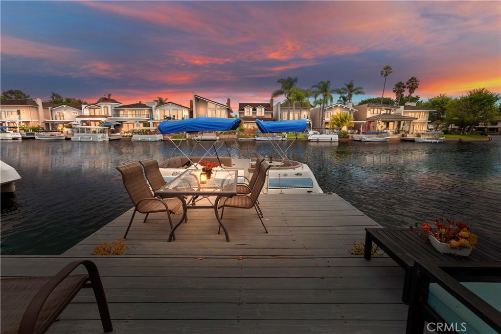 Welcome to this beautifully furnished lakefront home with stunning panoramic water views. The spacious patio is perfect for BBQs while enjoying the lake. This 5-bedroom, 3.5-bath home has an open layout, an upstairs balcony, and stylish living, dining, and kitchen areas. The HOA (Sun and Sail Club) membership offers access to tennis, swimming, volleyball, basketball,12 pickleball courts, a tot lot, fitness room, and an adult lounge. This stunning property offers a unique blend of luxury and recreation with dues covered by the landlord. Imagine taking in breathtaking lake views from the primary bedroom balcony. The home boasts a spacious 3-car garage and a California Room with bi-fold doors that open up for an unparalleled indoor-outdoor experience. Whether fishing off your personal dock or enjoying one of the 15 live concerts held on the lake each year, this residence epitomizes the Southern California lifestyle. The home does have access to a boat dock and perhaps a boat too! Inquire if interested.