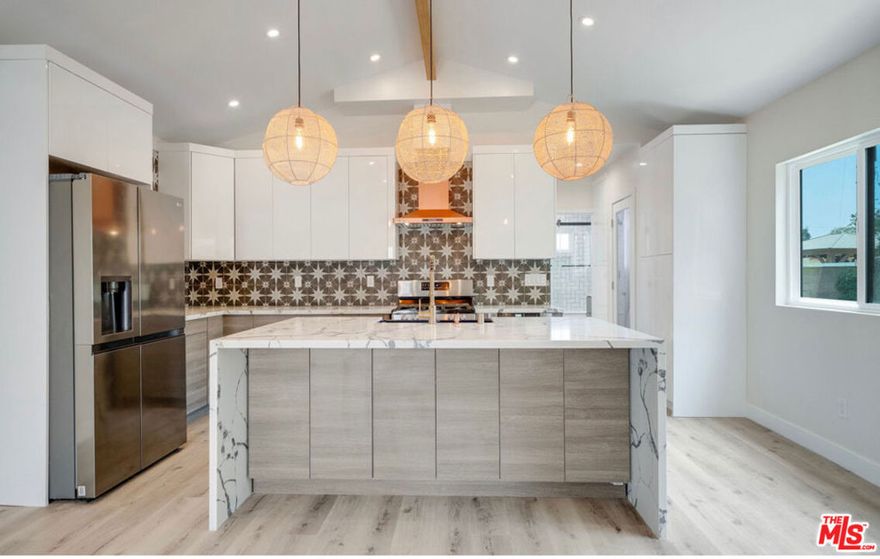 Welcome to this newly built, modern 1-bedroom, 1-bathroom home in the heart of Inglewood. Designed with vaulted ceilings and an open layout, it offers a bright and airy feel. The luxurious kitchen boasts European stone countertops, a waterfall island, stylish backsplash tile, and stainless steel appliances (refrigerator, stove/oven, dishwasher, built-in microwave). The spacious living area features wood-finish flooring, while the bedroom opens to a private patio, perfect for outdoor relaxation. Additional highlights include a stackable washer/dryer, ample storage, A/C & heat, and street parking. Centrally located, just minutes from SoFi Stadium, Intuit Dome, The Forum, YouTube Theater, Culver City, shopping, and dining. Don't miss out, schedule a tour today!