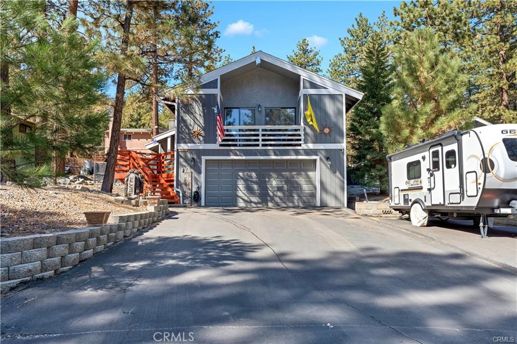 Are you looking for that perfect Mountain getaway? Come check out this home Nestled in the small town of Wrightwood***This Beautifully renovated home offers the best of Mountain living with all of the comforts of modern design**The decking has ample space for gatherings, BBQ's or for just sitting and enjoying the peaceful surroundings**The wood burning stove anchors the space with warmth, ideal for cozy night after a day of being on the slopes**The Kitchen offers Quartz counters and plenty of space for entertaining offering an open concept living area**Located just a few minutes to the Wrightwood Country Club or the nearby Ski Slopes**This home is a year-round haven for outdoor lovers or just simply soaking up the fresh Mountain air**Truly will not disappoint, this home is the perfect blend of Rustic charm & Modern design**