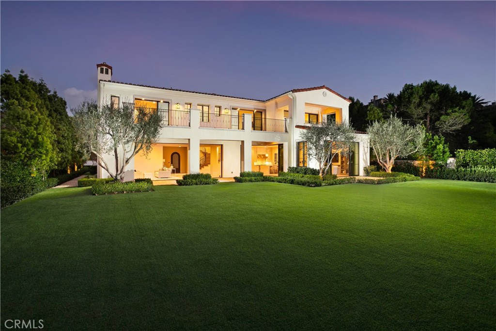 Positioned at the end of an exclusive cul-de-sac within the guard-gated enclave of Crystal Cove, 25 Spinnaker unveils a rare blend of architectural refinement, modern innovation, and coastal grandeur. Custom-built in 2018, this ~8,010 square foot contemporary estate is thoughtfully sited on a ~20,800+ square foot parcel, capturing uninterrupted vistas of the Pacific Ocean, Catalina Island, and Newport Harbor from nearly every vantage point.
Every element of this residence reflects exceptional craftsmanship and purposeful design. The open concept layout harmonizes grand scale living with effortless indoor-outdoor flow. Light-filled interiors reveal five en-suite bedrooms, including a main-level junior suite ideal for guests or multigenerational living, alongside 7 designer bathrooms, a sophisticated executive office, and an upstairs bonus lounge.
Curated with distinction, the home features a fully equipped state-of-the-art movie theater, whole-house water filtration system, and new air purification scrub filters ensuring unparalleled comfort and wellness. The chef’s kitchen integrates professional-grade Wolf appliances, custom cabinetry, and a generous center island designed for both culinary artistry and entertaining.
A private gated entry introduces the estate, opening to a grand motor court and a four-car garage equipped with custom built-in cabinetry and direct access to the residence. The surrounding grounds showcase lush, low-maintenance landscaping and provide a resort-like setting that creates the perfect setting for relaxation and entertaining, all complemented by sweeping ocean breezes and breathtaking panoramic coastal views. A testament to modern coastal luxury, 25 Spinnaker delivers privacy, prestige, and perfection. Just moments from the world-class dining, boutiques, and beaches that define the Newport Coast lifestyle.