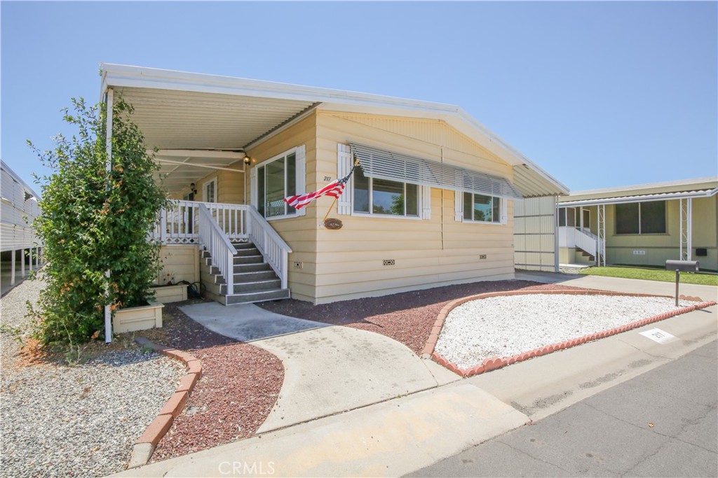 Discover this turnkey double-wide beauty in Sun City Mobile Estates, a highly sought-after 55+ gated community with patrolled security. This stunning home has been newly renovated throughout, offering a fresh, modern interior with exceptional attention to detail. It has new floors, countertops, appliances, paint! Step inside to a spacious living room that flows seamlessly into the dining area, complete with a charming built-in hutch. Enjoy the cohesive and low-maintenance lifestyle provided by the durable laminate flooring found throughout the two bedrooms and main living areas. The chef-ready kitchen boasts the necessary appliances, including a new stove, oven, and dishwasher, complemented by ample cabinets and counter space.
Comfort and efficiency are key, with dual-pane insulated windows ensuring comfortable temperatures and lower energy costs. Outside, you'll find spacious front and back decks, perfect for relaxing or entertaining guests. The exterior also includes a private deck with a gated parking area and privacy screens, a detached storage shed for all your extras, and low-maintenance landscaping.
Sun City Mobile Estates offers a vibrant lifestyle with fantastic amenities, including a Club House, Pool, Spa, BBQ and picnic area, and a fitness gym. Enjoy an active social calendar with activities like Bingo, Chair Volleyball, card games, and holiday parties!
Conveniently located, you're just moments from the freeway, shopping, restaurants, and more. Don't miss this incredible opportunity!