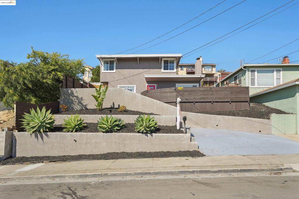 This stylishly updated 4-bedroom, 2-bath home blends comfort, functionality, and fresh modern design. Inside, you’ll find an inviting layout with gleaming hardwood floors, a contemporary kitchen with sleek finishes and stainless steel appliances, and two beautifully remodeled bathrooms. Large windows bring in natural light and hillside views, while the spacious backyard offers room to relax, entertain, or garden. A large storage shed with windows adds extra versatility—perfect for a workshop, studio, or bonus storage. With thoughtful updates throughout and a layout that lives large, this home is move-in ready and full of charm. Conveniently located near schools, parks, shopping, dining, and commute routes, it checks all the boxes.