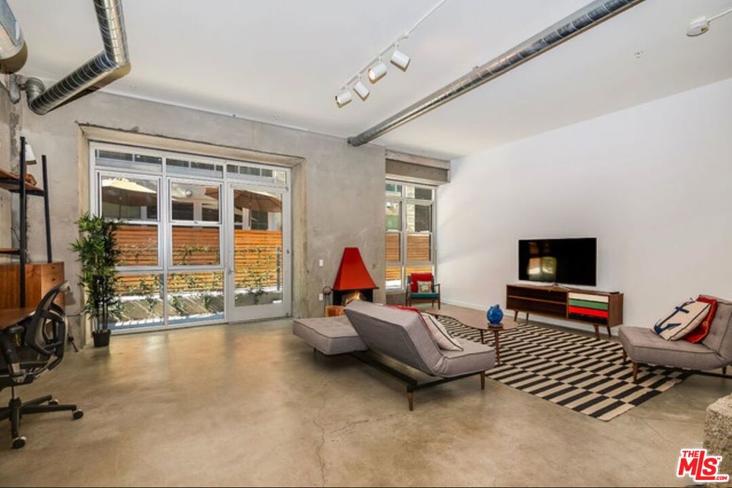 Experience urban living at its finest in this desirable ground floor unit at the renowned Barker Block in the Arts District. This open concept loft (no enclosed bedroom) with exposed beams gets good natural light through expansive double-pane windows. The kitchen is equipped with stainless steel appliances, ample cabinetry, and generous counter space, while in-unit laundry and closet storage add everyday convenience. Barker Block is known for its exceptional rooftop amenities, featuring a resort-style pool, cabanas, fire pits, BBQ grills, multiple seating areas, and panoramic views of the Downtown LA skyline. Residents also enjoy a fully equipped fitness center and stylish lounge areas throughout the community. This lease includes one secure garage parking space. Ideally located across from Urth Caffe and Arts District Park, you're just steps from the neighborhood's best dining, shopping, and entertainment, with easy access to freeways and public transit. A rare opportunity in one of DTLA's most desirable addresses, this is a must-see! Tenants responsible to pay for HOA Move-in/Move-out fees + Renters Insurance.