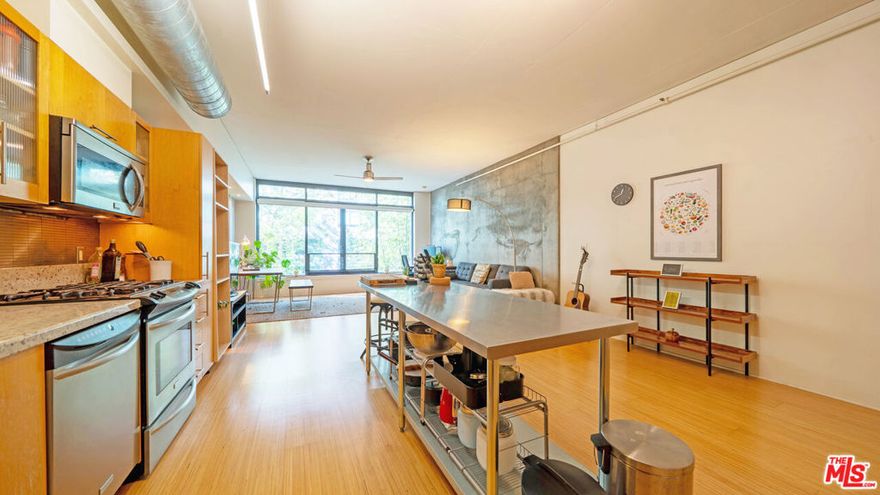 Well below tax assessor's value and previous purchase price. Seize the opportunity before someone else does. Experience urban sophistication in this stunning 1,100 sq ft soft-loft residence at the LEED-Certified "Elleven" Building, one of Downtown LA's most sought-after addresses.This spacious west-facing home showcases over $45,000 in designer upgrades, including beautiful bamboo flooring, custom six-foot smoked-glass sliding panels with a sleek stainless-steel header and solid-wood framingproviding an elegant sense of bedroom privacy while maintaining an open, airy flow.The wall-to-wall windows fill the space with natural light and offer tranquil treetop views accompanied by the soothing sounds of the community's water feature below. The modern kitchen features stainless-steel appliances, granite countertops, and a stainless mosaic backsplash, perfect for both cooking and entertaining.Additional highlights include recessed lighting, a large laundry room with built-in storage, a custom closet organizer, and one assigned parking space conveniently located next to a private storage rooma rare and valuable amenity in DTLA living.Located in the vibrant South Park District, you're just steps away from LA Live, Crypto.com Arena (formerly Staples Center), Microsoft Theater, Ralphs, FIDM, and countless acclaimed restaurants, cafs, and lounges.