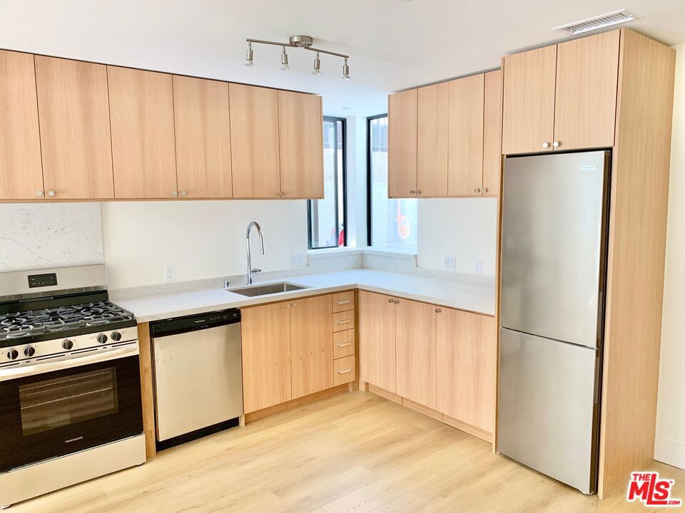 Discover elevated urban living in Westwood's newest modern apartment community. Perfectly tailored for professionals, students, and families, this brand-new construction 16 unit complex blends modern style with comfort and functionality. Be the first resident! Apartment 103 is rear-facing and is one of the most desirable units in the property. It features a 2 bedroom/2 bathroom open concept layout and is equipped with new stainless steel appliances, in-unit laundry, and central air and heat. Perhaps its most alluring quality, however, is the spacious and private back patio. Enjoy the ease of secure underground parking and working remotely from the rooftop deck. 1822 Overland is centrally located to major employment, freeways, and points of interest alike. Residents will enjoy the short 1.5 mile or less proximity to the UCLA campus, Century City Mall, the 405 freeway, and the upcoming Metro Purple Line extension stops at Wilshire/Gayley and Constellation/Avenue of the Stars. Don't miss this opportunity your new luxury lifestyle awaits!