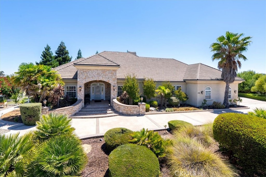 Stunning Custom Home with Sweeping Views on 1.5 Acres.
Welcome to this beautifully crafted custom-built home, offering breathtaking views and privacy—all within the city limits. Nestled on a generous 1.5-acre lot behind a gated drive, this residence combines the best of security, exclusivity, and convenience.
Step inside the expansive 3,113 sq ft home, thoughtfully designed with 3 bedrooms and 2.5 bathrooms. The layout offers generous living spaces, elevated finishes, and a seamless indoor-outdoor flow—perfect for both daily living and entertaining. The gourmet kitchen is a true showstopper, equipped with quality appliances, a new built-in refrigerator, custom cabinetry, and a large island ideal for cooking and gathering. The adjacent living and dining areas are warm and inviting. The living room offers custom built-ins and a beautiful fireplace.
The luxurious primary suite is a private retreat, complete with a lounge area, built-in desk, oversized walk-in closet, fireplace, and a spa-inspired ensuite bathroom featuring a soaking tub, walk-in shower, vanity, and direct access to a private patio with a sauna.
Step outside to enjoy a Central Coast lifestyle made for entertaining, with an outdoor BBQ area, spacious covered patio, and plenty of room to relax. The property extends down a sloped area that has potential for an ADU or pool.
The oversized three-car garage boasts high ceilings with an RV door, ideal for vehicles, RV storage, a home gym, workshop, or additional hobby space. Additional features include an owned solar system, city utilities, mature landscaping, and a serene, private setting.
Don’t miss this rare opportunity to own a beautifully appointed custom home with views, space, and an exceptional Paso Robles lifestyle.
Bring all offers!