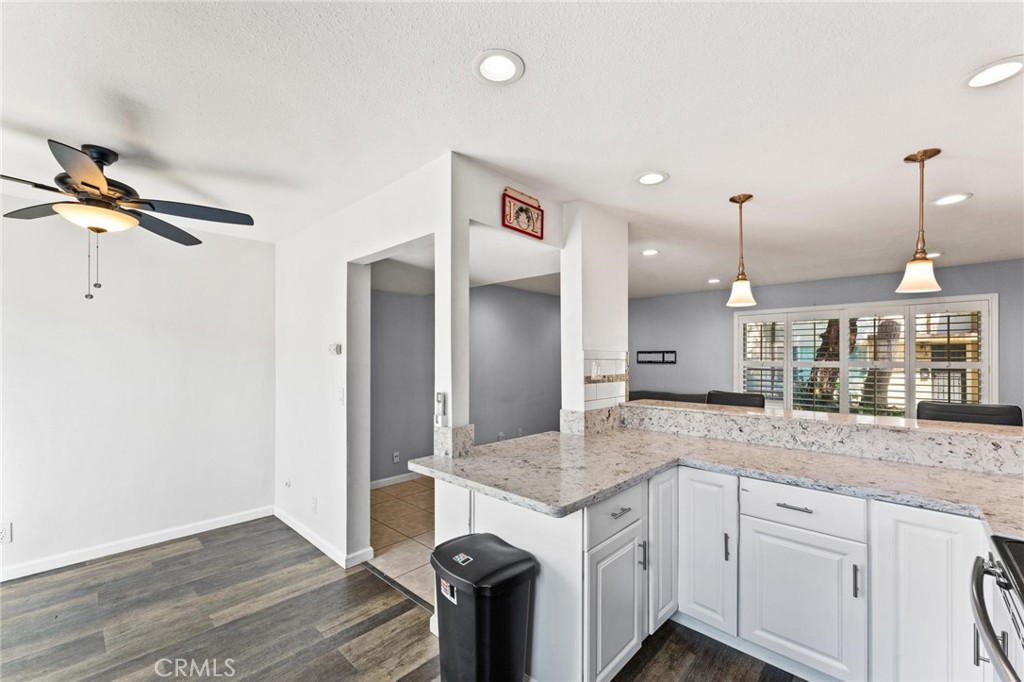 Step inside this beautifully upgraded 3 bedroom townhouse in Tustin and you’re welcomed by a spacious living room with engineered wood floors, plantation shutters, and abundant natural light — a comfortable space for both relaxing and entertaining.
The modern kitchen is a highlight, featuring quartz countertops, sleek cabinetry, and stainless steel appliances. It flows seamlessly into the dining area, where sliding doors open to a private patio — perfect for morning coffee or weekend barbecues.
Upstairs, the expanded primary suite offers a generous retreat with shutters, ample closet space, and a stylish en-suite bath. Two additional bedrooms share a well-appointed hall bathroom, ideal for family, guests, or a home office.
Additional conveniences include an in-unit washer and dryer, AC, updated electrical, and a 2-car garage.
The community provides resort-style amenities such as a sparkling pool, clubhouse, lush greenbelts, and playgrounds — all set in a prime Tustin location close to shopping, dining, and schools.