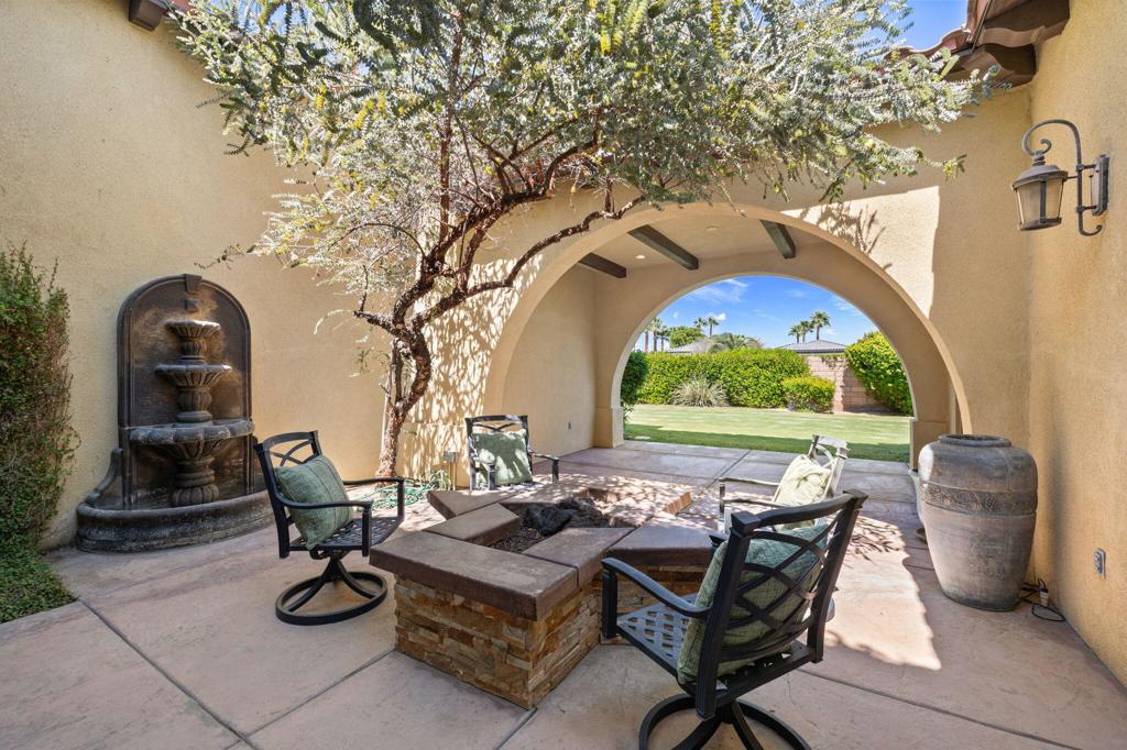 Experience desert living at its finest in this elegant 4 bedroom, 4 bathroom South La Quinta estate, complete with a private detached casita. Built in 2006 and offering approx. 3,150 sq. ft., this residence blends timeless architecture with refined finishes. Dramatic soaring ceilings, graceful archways, and numerous French doors create a seamless flow between indoor sophistication and outdoor serenity. Featuring a formal living room, formal dining room, and cozy room off your kitchen with breakfast nook, there is ample space and flow.The gourmet kitchen is a chef's dream with granite counters, custom cabinets, stainless appliances, Sub-Zero built-in refrigerator, and a butler's pantry--perfect for effortless entertaining.Multiple living and dining spaces provide both grand scale and intimate comfort, while the expansive primary suite offers a private retreat with spa-like ambiance in the primary bathroom.Set on an oversized lot with ample room for a resort-style pool and entertaining space, this home embodies the perfect balance of luxury, comfort, and desert elegance. A rare opportunity to own a true La Quinta sanctuary.The low monthly HOA covers your front yard landscape and offers a sports court with playground, as well as controlled access to Carmela which is just adjacent to the esteemed Madison Club.Do not wait on this one, these floor plans do not come up often and this special one is being sold turn-key furnished!