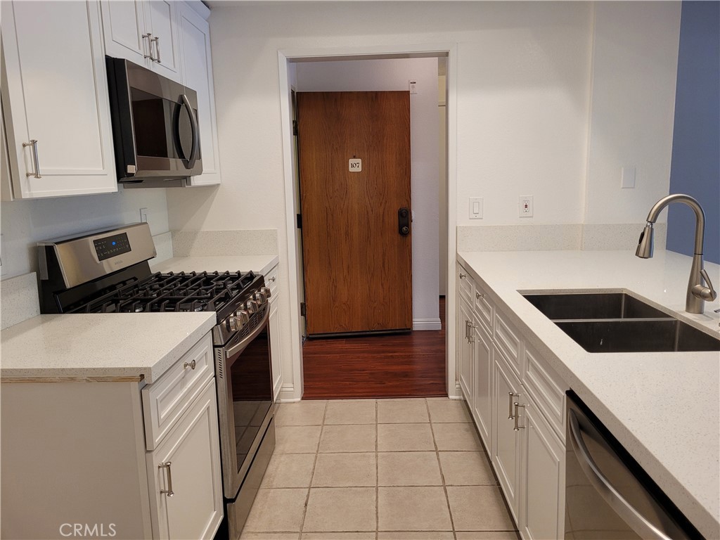 24hr security guarded gated Windemere complex first floor two-en suite bedroom with large-sized bath area with double vanity sinks and large closets. One powder room is located near an open space living area easily accessible to guest(s). Newer hardwood flooring, gas range, microwave and dishwasher. HOA/Lease includes trash, water, internet, cable TV, and few others. Landlord also provides washer/dryer in laundry room and pantry adjacent to kitchen; two underground assigned parking spaces #4, #6. Did I mention huge exclusive use of patio accessible from both bedrooms and Livingroom. Check out photos of interior that shows quality of improvements.
Windemere community features a tree-lined gated entry with security guards. Recreational facilities include a multi-million dollar clubhouse with a full kitchen and indoor dining room and poolside tables. Indoors: three racquetball courts, basketball court, a game room, men and women locker rooms with saunas, and gym. Outdoors: a tropical inspired pool area surrounded by palm trees, lap pool, and large Jacuzzi. Throughout the grounds are two smaller Jacuzzis and several barbeque grill areas. Wilson Park (with large Farmer’s market every Saturday and Tuesday); short drive to Torrance beach and the Redondo Beach pier.