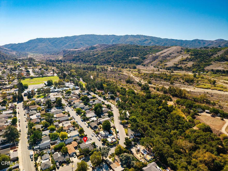 Two homes on one lot.  The original and charming 1948 home greets you with a secluded garden and welcoming front porch. Featuring two bedrooms, one bath, and a flexible bonus room ideal for work, fitness, or hobbies. The living area showcases rich wood flooring, updated dual-pane windows, and wood burning fireplace. The large dining room flows into a redesigned and enlarged kitchen featuring quartz countertops, modern cabinetry, stainless steel appliances and generous storage. The two bedrooms each have mirrored closed doors. The bathroom has been thoughtfully updated. Recent enhancements include upgraded 220-amp electrical service, a Lennox HVAC system, dual pane windows throughout newer interior and exterior paint and newer main gas line. The huge bonus room also includes a laundry closet and additional space for so many creative uses.The separate accessory dwelling unit (ADU), completed in 2023, offers its own entrance, private yard, and stylish interior. The living room features Wailua Luxury plank flooring, contemporary dual paned windows, ceiling fan and recessed lighting. The kitchen is outfitted with a floating bamboo floor, quartz countertops, a deep farmhouse sink, and an inviting garden window. The big bedroom features a huge closet, two windows and skylight adding lots of natural light. The ADU is equipped with a Mitsubishi dual-zone climate system, newer wiring and plumbing, and energy-efficient spray foam insulation. It enjoys its own private street-facing entry and separate private backyard access. Situated on a corner lot, the property includes a two-car covered carport. Nestled near the scenic Ojai Valley and its popular bike trail, the location is within walking distance to a local market, coffee and donut shops and popular breakfast spot. Oak View offers easy access to both downtown Ojai and Ventura, with the ocean just a good bike ride away. Whether you're heading to the beach or exploring nearby vineyards, this setting offers convenience and charm.
