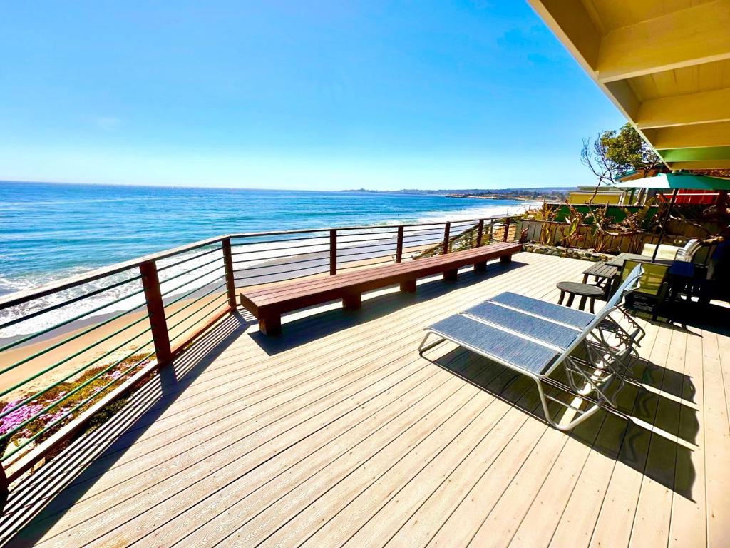 ON THE SAND! One of the truly rare, ocean-front & on-the-sand surf properties in all of Santa Cruz! Watch the whitewater waves crash & the whales splash right from your living room. Serve cocktails on the expansive ocean-front deck with ear to ear views of the Monterey Bay and Santa Cruz coast line. Enjoy a private gate with DIRECT ACCESS and steps down to the beach from your back deck. This 4 bedroom, 3 full-bath beach house sits in "POSITION A" as you can literally surf, kayak or snorkel right in your back yard. A quaint tropical courtyard with a custom rock-laden surf shower greets you as you enter the main entrance of the property. A gorgeous wooden entry door opens to the entry & flows to the open floor plan that boasts a full-ocean-view gourmet kitchen, ocean view dining room, & a living room where one can watch TV and see the dolphins jump at the same time. Stainless appliances, granite counters, custom cabinets and a 5-person breakfast bar adorn the modern kitchen. Take the custom tile steps up to the large Primary Suite that sits perfectly above the water line and boasts floor to ceiling white water views. Primary includes dual sinks, marble shower, walk-in closet, dressing area & access to the jaw dropping views from the 2nd story deck. Beach House perfection!
