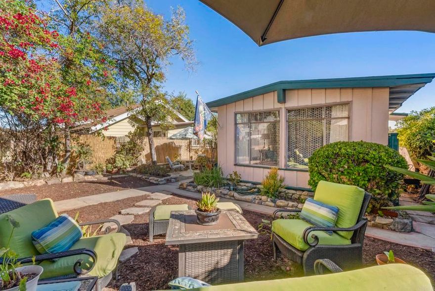 Diamond in the rough found in the Jewel of the Hills! Treasure discovered in the heart of La Mesa Village!    Walk to endearing streets of downtown La Mesa and find the community you crave.  This is the setting you have been searching for! This 1954 Mid-Century Modern design sits atop a 5,479 square foot lot at the top of Acacia Avenue.  The panoramic view reaches out over  rooftops and treetops to Mt Helix beyond.  You will be greeted by hand laid rock walls framing the garden foliage and providing a warm welcome to this tranquil retreat.    A shady, rock-lined garden path connects the front and back yards providing plenty of outdoor space to enjoy year round.  The alley access at the rear of the property provides spacious off street parking.  Once inside you will be captivated by the dramatic wood and glass design elements that the mid-century modern era is famous for.     The original picture windows bring the outdoors inside along with the sunsets.  The garden view is the focal point of the expansive living room which also overlooks the patio and palms beyond.    The kitchen offers abundant cabinets, gas range, dishwasher, and sunny window above the sink.   You will discover three bedrooms on the main level and one bonus bedroom on the lower level with its own access to the backyard and rear parking.  The original hardwood floors are well-traveled and can be found in most of the rooms throughout.    The charming dining room is the heart of the home.   If these walls could talk you would learn that for the past 59 years one amazing woman raised 8 kids in this humble home.  There was always room for one more at the dinner table, but not much room in the budget for remodeling. You will find a long list of improvements to make here but, you will not find a home with more potential, not to mention the parking!  The memories you will make here will make it worth the effort.  Dream big and bring a hammer!