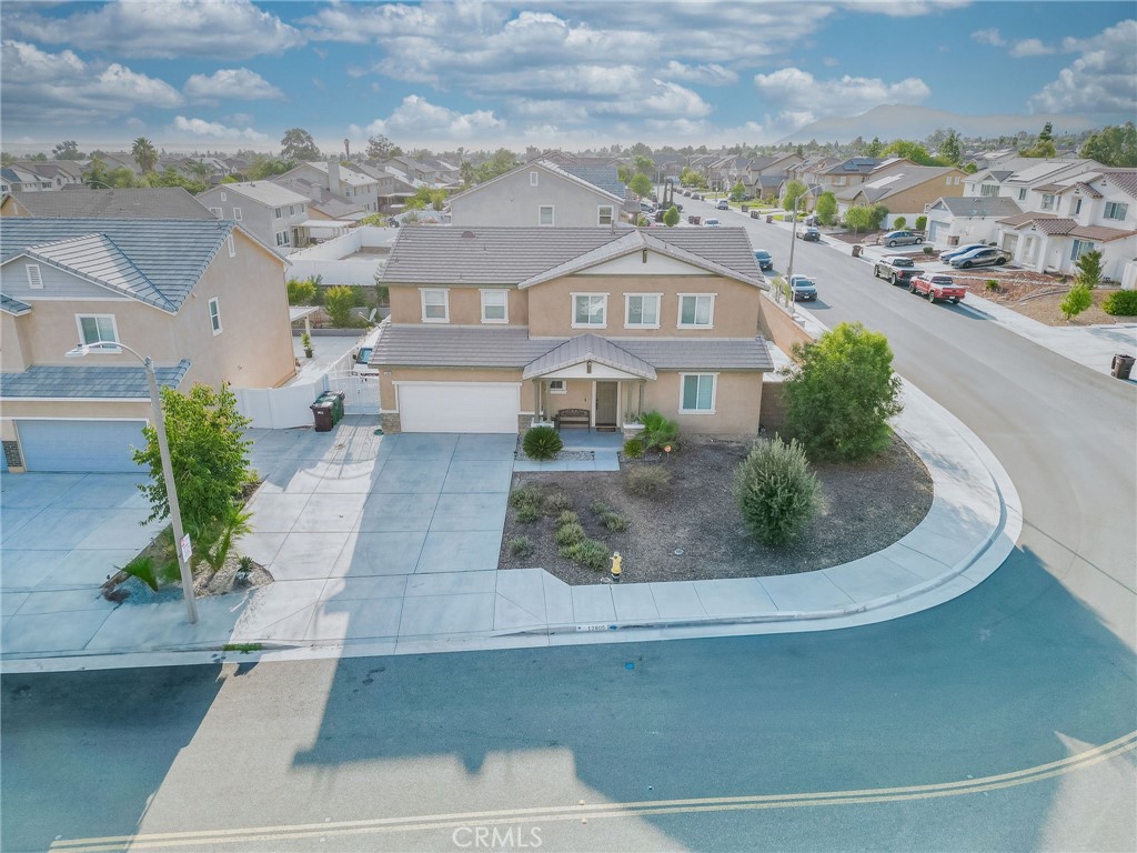 Deal of the Week! Welcome to 12805 Wainwright St in Moreno Valley—where location speaks for itself. Sitting on a desirable corner lot, this home offers an open floor plan, paid-off solar, and stylish vinyl flooring on the first level with carpet upstairs. The main floor includes a convenient bedroom and full bathroom for guests. Enjoy a tandem garage and a backyard built for entertaining with a vinyl patio cover, two ceiling fans, and a brand-new built-in gas BBQ. Close to all three grade levels of schools, nearby shopping centers, and quick access to the 60 Freeway—this home is perfect for families or investors looking for value and location.
