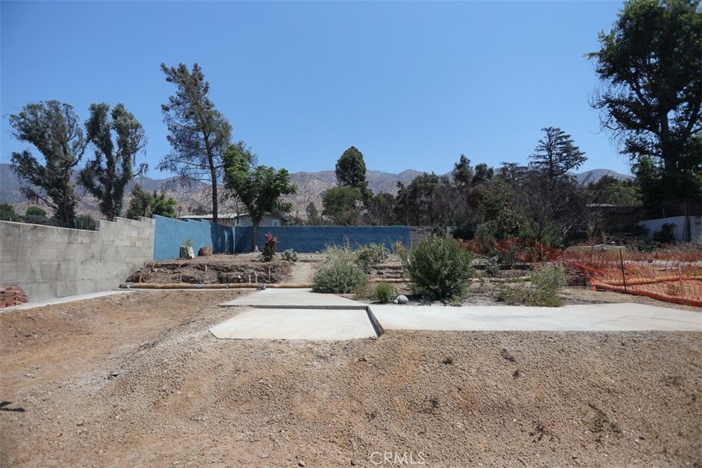 This is a beautiful Lot situated in the scenic Foothills of Altadena, ready for you to build your new home on! This Lot is 7753 Square Feet per Assessor and has a great location in Altadena. The Lot has been cleared and has completed Stage 1 and Stage 2 of the NHP/ FEMA regulations. This Lot is ready to start your new build amongst a great community that will welcome your new Home build. You already have a nice dividing wall at the back of the property as well as a backyard area complete with built in drainage system to the street. Buyers to do their due diligence on the building process and regulations and codes. Great location located next to Hiking in the Foothills and Parks as well as Lake Ave shops and restaurants! Feel free to Drive by. . If you would like to walk the property call the Agent Paul Dutton. The previous house was burnt down in the Eaton Fire.