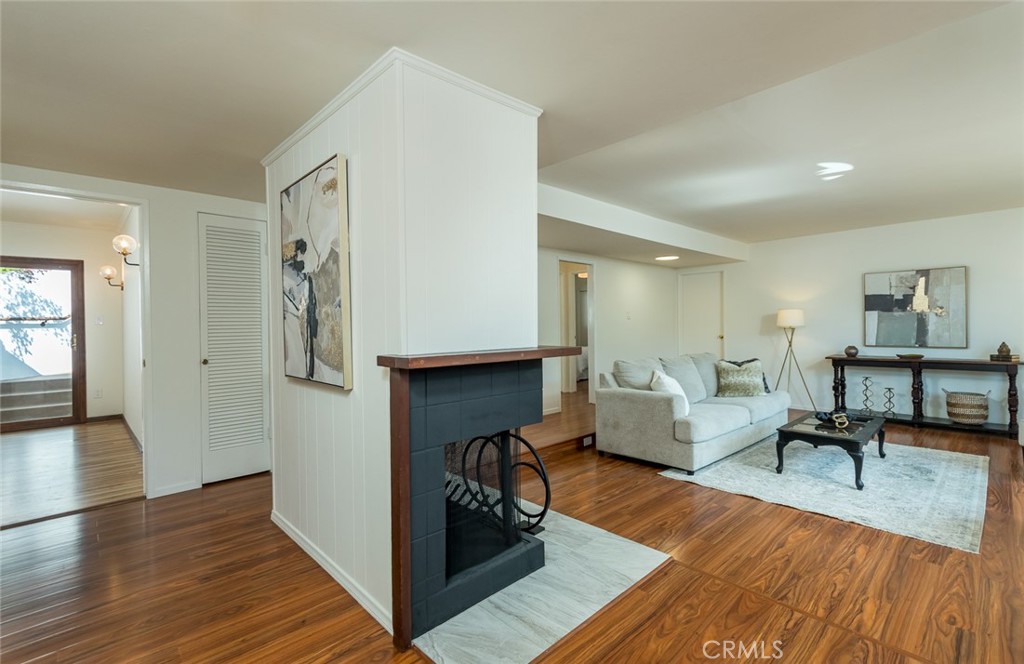 Welcome to this charming 3-bedroom, 2-bathroom hillside retreat in the much-desired Chevy Chase Canyon. The home built in 1965 is filled with character. This 1,674 sq. ft. home features bright, open living spaces with stunning treetop and mountain views. The spacious living room is highlighted by large picture windows that flood the space with natural light. There are three comfortable bedrooms that including a primary suite with an en-suite bathroom and a spa-like tub, mirrored wardrobes, and peaceful views. The kitchen is complete with double ovens, a new refrigerator, and plenty of storage. Enjoy your mornings on the landscaped terraces, with views of the mountain and golf course. With a 5,051 sq. ft. lot, the outdoor living feels both private and serene. A two-car garage provides ample storage as well as laundry hookups, tankless water heater, and workspace. It is ideally located to Chevy Chase Country Club, Wild Oak Café, Descanso Gardens, ArtCenter College of Design, Rose Bowl, JPL, Old Town Pasadena, The Americana, as well as freeway access. This home offers the perfect blend of tranquility and convenience in Chevy Chase Canyon.