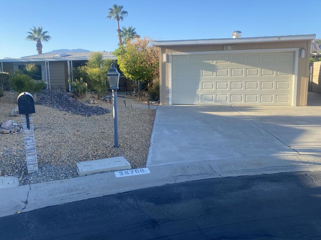 This great manufactured home is located in Palm Desert Greens Country Club on an interior Cul-de-sac street and is on a permanent foundation. Sporting a two car garage with garage door opener for your convenience and storage cabinets for your extra storage needs. Outside you'll have two large outside sheds which are located in the backyard. As you enter the front door entryway and looking to your left is an updated kitchen with tiled counters and updated appliances and lots of storage for your culinary needs and yes a pantry as well.You'll enjoy having three bedrooms each with a seperate bathroom for you and your guests privacy, The two main bedrooms are at opposite end of this home again for privacy when guest arrive. Off the side of this home is a very large private patio with a covered seating area to enjoy the built in hot tub. Do you golf, play tennis, pickleball, shuffleboard, bicci ball, it's all here and more, Cub house, restaurant, bar, golf shop. It's all here waiting for you in this active 55 or older active community with over 40 clubs to meet your hobbies and desires. A diamond in the ruff? Definitely. Come see what the hype is all about you won't be sorry.