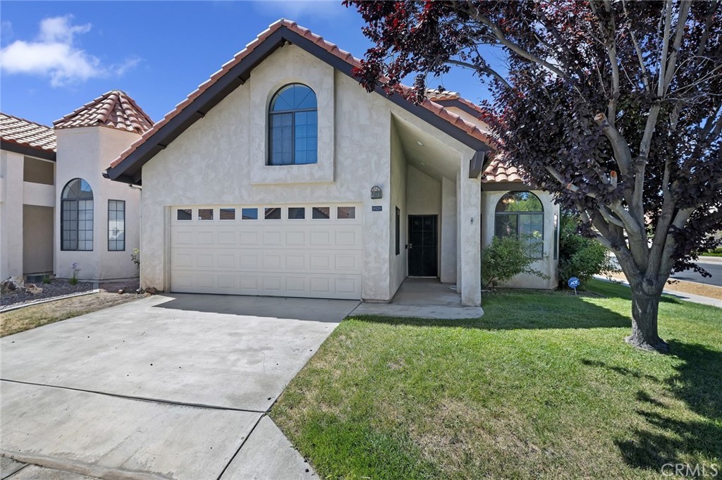 WELCOME TO ONE OF THE MOST COVETED HOMES IN THE HIGHLY SOUGHT AFTER 55+ COMMUNITY OF JESS RANCH! A RARE STANDALONE RESIDENCE WITH NO SHARED WALLS NESTLED ON A PRIME CORNER LOT FOR MAXIMUM PRIVACY, SPACE AND CURB APPEAL! Surrounded by a tranquil wrap-around greenbelt, this beautifully maintained property offers the perfect blend of serenity and convenience in a vibrant, active adult setting. Property Highlights include but is not limited to: 2 spacious primary bedrooms, each with walk-in closets. 3 full bathrooms, including a reglazed shower/tub enclosure. Bonus upstairs room ideal for an office, craft space, library, or optional third bedroom. Open concept living area with plantation shutters and fresh new paint. Updated fixtures, new carpet, new doorbell, and refreshed electrical components. Fully equipped kitchen with stove/oven, microwave, dishwasher, garbage disposal, and two refrigerators with freezers. Inside laundry area with stackable washer and dryer. Attached 2-car garage with new blind for added privacy. Community Perks include but is not limited to: Gated access through Gate 2 for added security. Brand-new clubhouse, pool, fitness center, and walking trails just steps away. Optional golf access for enthusiasts. Minutes from Jess Ranch Marketplace and Apple Valley’s shopping, dining, and entertainment. Whether you're looking for a peaceful retirement retreat or a stylish, low-maintenance home in a thriving 55+ neighborhood, this property checks every box—and then some. With its rare standalone design, upgraded features, and unbeatable location, this home won’t last long. Buyer to verify all info.