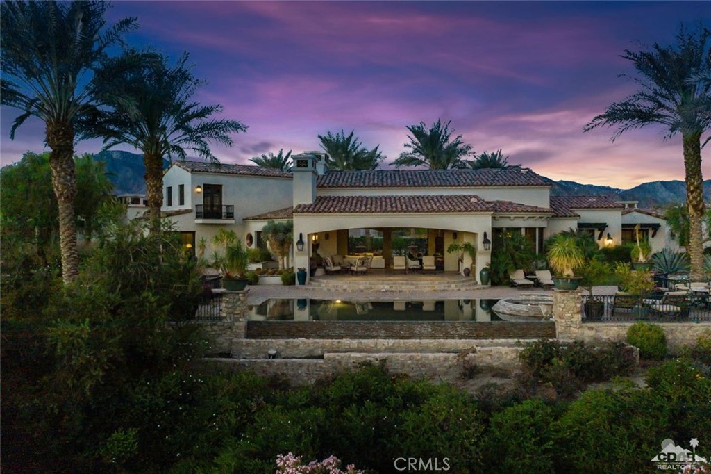 This extraordinary estate located behind the gates of The Madison Club blends exceptional design and elegance. Situated overlooking the 3rd and 4th fairways of the Madison Club's Tom Fazio course, it offers expansive views of the Chocolate Mountains to the east and the Santa Rosa's to the west. The great room features powered telescoping sliding doors, creating a cohesive and relaxing indoor/outdoor entertaining space. The entertainers kitchen boasts an open concept w/butler's pantry & bar-top seating. The desert climate is great for hosting friends on your expansive outdoor patio, swimming laps in your infinity pool, or relaxing with a glass of wine around the fire pit. The separate 2 bed 2 bath casita w/kitchenette, dining/poker room & private entry and outdoor fireplace is idyllic. The home is a serene sanctuary filled with amenities including a private stadium-styled theater, in home gym and office space. Offered furnished per Seller's inventory.