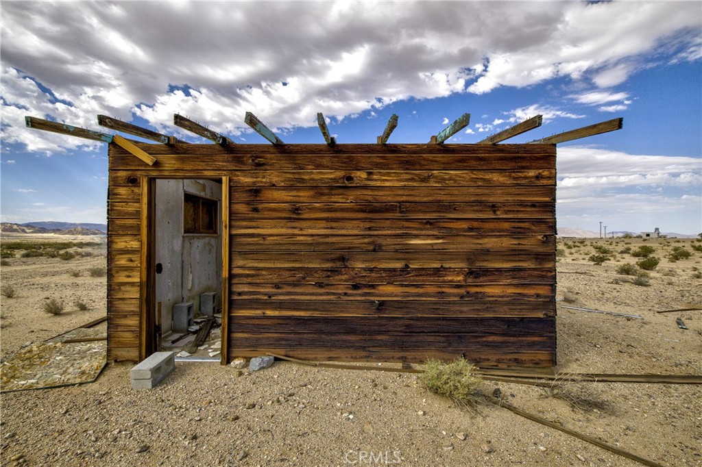 Rustic 384 sf cabin shell on 5 acres! The one-room cabin was built in 1954. There is a poured concrete area along the front of the cabin. Maybe you can take it down to the studs and rebuild it! The cabin currently has no utilities. Wiring is visible in the walls. The buyer can investigate drilling a well (or use hauled water) and installing a septic system. Great privacy is ensured because the 5-acre parcel adjacent to the west is federal land, where no one will build. See the starry skies at night!
