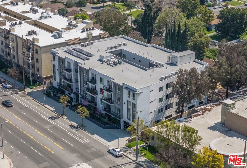 We are proud to present "The Burbank", a 21-unit condominium property located at 11616 Burbank Blvd in North Hollywood, CA. Built in 2018 to condo specications, this property is 100% free of all rent control. The 30,817 sqft building sits on a 0.42 acre lot, and it boasts an excellent unit mix (15) 2 Bed / 2 Bath condos and (6) 3 Bed / 2 Bath condos. All of these modern condos are very large, with the average 2-Bed at 1,387sf and the average 3-Bed at 1,575sf. Of the 21 condos, 19 are market-rate and 2 are low-income restricted (both low-income restricted condos are 2 Bed).The property has gated parking on the ground oor with three levels of residential above. Each of the three residential oors have 7 condos with a stacked design. The condos are fully equipped with a high-end gourmet kitchen, stainless steal appliances and kitchen islands. Also included in each unit is a washer and dryer, balcony and exceptionally large space cabinetry and closets. The building is laying on a beautiful clean boulevard and is equipped with 8kwp solar panels and 9 EV chargers.Currently, this condo buildings is being operated as apartment rentals, and 21 condos are 100% occupied with all tenants paying rent. The 21 condos bring in a combined $66,500 of rent per month, or $798,000 per year. A recent rent survey suggests full market-rent potential at $77,500 per month, or $930,000 per year, presenting an investor with approximately 17% upside if they choose to continue operating the property as apartments.These condos offer an excellent exit strategy to sell them off individually. A survey of recently sold condos in the South Valley shows that newer construction 2 and 3 bedroom condos are selling for an average of $655 per sqft. With the building currently priced at just $341 per sqft (below today's replacement cost), there's millions of dollars in prot potential for an investor who's willing to put in the time to sell these condos individually. Importantly, selling these individually would allow the buyer to avoid expensive ULA transfer taxes on the exit. The Burbank is located within short distance to the heart of NOHO Arts District where there's a plentiful amount of restaurants, shopping, cafes, gastropubs, and nightlife. The property has easy access to the 170/101 freeways, allowing for easy commuting to anywhere throughout Los Angeles and beyond. Its proximity to Burbank, Studio City, and Hollywood positions it as an ideal home for those seeking access to the best the area has to offer.