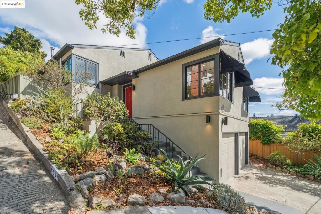 Charming, spacious, and ideally located, this cherished abode offers the very best of Rockridge living, combining traditional style with a flexible floor plan, making it a rare find in one of Oakland’s most sought-after communities. From the light-filled living room with classic divided light casement windows to the private upstairs retreat and versatile lower level, every space has been thoughtfully designed to support the rhythms of everyday life. The formal dining room connects seamlessly to the sunny kitchen and breakfast area. A full bath, laundry room, and two bedrooms—each with hardwood floors and generous closet space—complete the main level. Upstairs, you’ll find a private primary suite, featuring a spacious bedroom, walk-in closet, and en-suite bath. The lower level adds even more flexibility with an additional room and full bath, ideal for an office or studio. 2-car garage and storage. Outdoors, the backyard provides room to relax, gather, or garden.