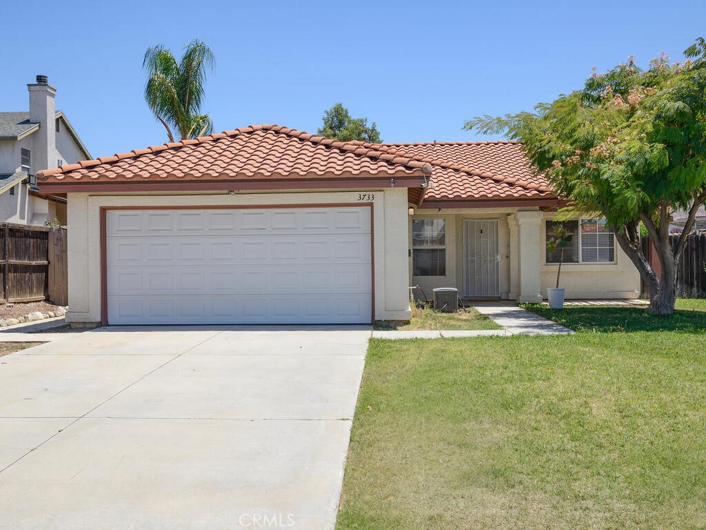 Just Listed in West Hemet! This home has an assumable FHA loan with a 4.99% interest rate, call for details!
Lovely 4 bedroom, 2 bathroom single story home located close to West Valley High School and Harmony Elementary. As you enter the home, you are greeted by the spacious living room with high ceilings and a fireplace. The living room will lead you to the dining room and kitchen that feature tile flooring, a walk in pantry, ample cabinet and counter top space, and a slider door that leads you to the covered back patio and spacious back yard. All of the bedrooms are down the hall from the living room. There is a double door entry to the 4th bedroom, this room is noted as a bedroom by the builder and does not have a closet and could be used as a bedroom or an office area. All the bedrooms are good sized and have ceiling fans. The primary bedroom features a walk in closet with mirrored closet doors. There is a private bath in the primary with a step in shower and double sinks. There is a 2nd full bath in the hall. Tesla charger installed in the garage! You will save money in the low tax, no HOA neighborhood, AND an assumable FHA loan with a 4.99% interest rate. Call for details, and plan your visit today!