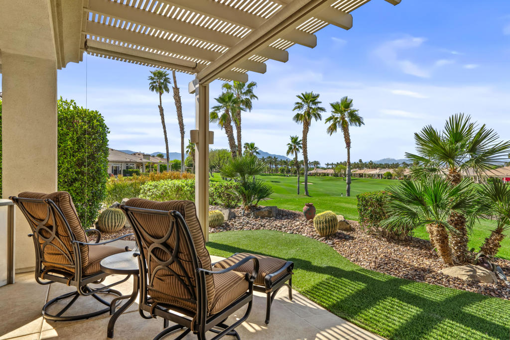 BEAUTIFUL PANORAMIC Fairway & Mountain views from this elevated site on the 15th fairway in Heritage Palms. Featuring 3 bedrooms, 2 1/2 baths, a large open design with fireplace in the family room, beautiful slab granite kitchen counters with cherry wood cabinetry including the optional buffet, stainless/black appliances, and upgraded picture windows replacements of the entire rear/view side of the home. The spacious primary suite with optional bay window features a large bathroom with soaking tub, separate shower, dual vanities, walk-in closet and french door to your covered rear patio with flagstone style overlay. Motorized drop down shades, brick paver walkway, drought tolerant desert landscaping, artificial turf and plenty of room for entertaining your friends & family or simply taking in the spectacular views. Bedroom #2 not shown in pictures. ( please refer to the floor plan shown). Additional upgrades include brick paver driveway, golf cart parking area, hanging racks, garage A/C unit, both of the homes A/C units and furnaces have also been replaced. Heritage Palms is a premier adult community featuring an 18 hole championship golf course, indoor & outdoor pools, pickleball & tennis courts, fitness center, billiards room, card rooms, grill room, social clubs and more.