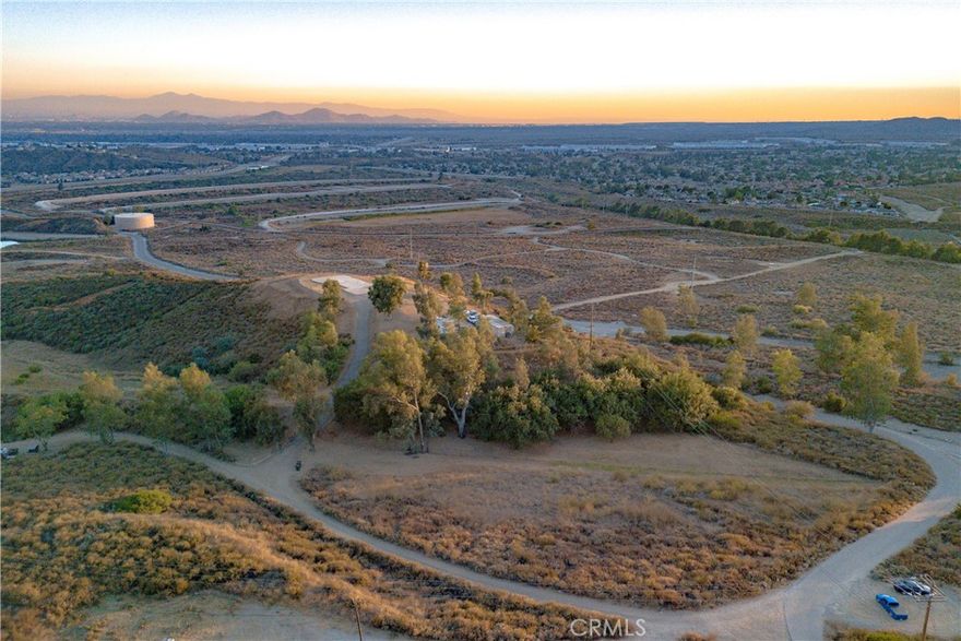 Ready to build!! Trailer and storage containers on site!! Enjoy complete privacy and breathtaking 360-degree views on this stunning 15.8 acre parcel. Looking for storage, parking or to build a custom home? This beautiful parcel has endless opportunities! Bordered by California Forestry and San Bernardino County-owned land, this parcel offers unmatched seclusion and unobstructed views. Experience beautiful sunrise and sunsets, serenity and nature at your doorstep at this hill top oasis. This parcel is truly one of a kind. Located in close proximity to the 215 fwy, 210 fwy, 15 fwy, shopping, dining, hiking trails, paragliding & hang-gliding, Cal State San Bernardino, Murillo Family observatory and much more. Zoned RL, water connected on site, electricity available on site, paved road access and low taxes. Opportunity to build multiple homes on site (approx 3 homes per acre). Multiple Flat land areas as well a gentle rolling hills. Video virtual tour is attached to this listing.