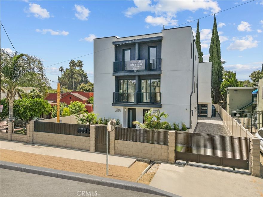 Welcome to 13942 Vanowen St. This new front unit combines modern design with practical use in the heart of Van Nuys. This spacious unit has three bedrooms and three full bathrooms, laid out in an open design. It offers a total of 1,942 sq ft, which includes a private garage and laundry area, with approximately 1,425 sq ft of comfortable living space. On the main level, there is an open living room with a balcony, one bedroom, and a full bathroom. This space is great for guests or a home office. Upstairs, you will find two bedrooms, each with its own bathroom, providing comfort and privacy. The primary suite also has a private balcony. A second balcony off the living room creates a smooth flow between indoor and outdoor spaces, perfect for relaxing or entertaining. This home features quality finishes, plenty of natural light, and direct access to the garage. It is ideal for those looking for comfort, convenience, and style. Located just minutes from Valley Glen, major freeways, and local amenities, this is a great chance to own a modern home in a sought-after San Fernando Valley neighborhood.
