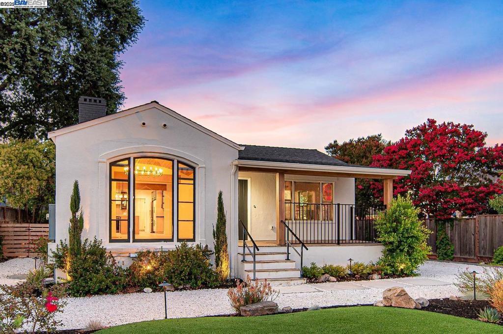 Completely updated in 2025, this artfully reimagined home in Downtown Pleasanton blends modern European design with open-concept living and high-end finishes throughout. Expanded to 3,440 sq ft, it features a custom kitchen with quartz waterfall island, sleek black appliances, and a spacious primary suite with soaring ceilings, linear fireplace, and French doors to the backyard. Two additional bedrooms share a stylish full bath, and a spacious utility room sits just past the kitchen. The finished lower level, built to current ADU specs, includes a full kitchen, dining and living areas, two bedrooms, a full bath, a private entrance, and interior access—ideal for multi-generational living, long-term guests, or investment potential. Separate electrical meters and shared HVAC system provide flexibility. The drought-tolerant front and back yards include a three-hole putting green and space to relax or entertain. Detached two-car garage with modern glass door and epoxy floors can serve as a garage or versatile flex space, perfect for a game room, studio or workshop. All just blocks from downtown Pleasanton. Open House Fri, Aug 15, 10a-1p | Sat & Sun, Aug 16-17, 1-4p.