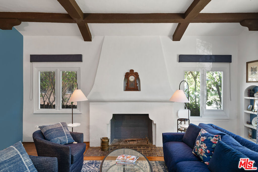 On the market for the first time since 1972, this 1931 Spanish gem welcomes you with lush landscaping and timeless curb appeal. Inside, plaster walls, arched openings, and original details evoke the romance of Old Los Angeles, while a thoughtful 2-bedroom, 2-bath layout creates warm, livable spaces. From the living areas, the home unfolds to a deep, oversized backyard: a rare setting for entertaining today or envisioning future expansion. The detached garage extends possibilities for studio, office, or guest use. Set on a quiet, tree-lined street in prime Westwood, you're moments from Westfield Century City, UCLA, and Westwood Village, with access to the coveted Westwood Charter School district. More than a home, this is a once-in-a-generation opportunity to own a piece of Westwood's history with room to shape its next chapter.