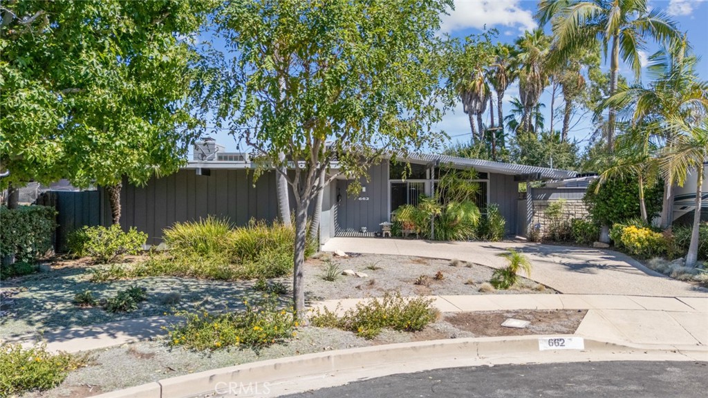 From the moment you arrive at 662 Rapallo Avenue, it’s clear this is a home that has been cherished and thoughtfully maintained. Designed in 1954 by renowned Southern California architect Edward H. Fickett, this striking mid-century post-and-beam sits gracefully in the desirable Miraleste Pines neighborhood of San Pedro. Step inside and you’ll discover modern updates that blend seamlessly with the home’s original architectural spirit. The inviting living room sets the tone with its wood-burning fireplace, dramatic peaked ceilings, and clerestory windows that bathe the space in natural light. A signature block half-wall pays homage to Fickett’s vision, while the former atrium—now enclosed as a bright artist studio or home office—offers custom built-ins and an inspiring retreat for creativity or remote work. The kitchen has been refreshed with granite counters, updated cabinetry, tile backsplashes, stainless steel appliances, and under-cabinet lighting, delivering both style and functionality. True to Fickett’s design philosophy, the home balances indoor comfort with outdoor beauty. The rear patio provides the perfect spot for a morning coffee or evening cocktail, all while staying connected to the home’s warm, welcoming character. With 3 spacious bedrooms, 2 updated baths, and upgrades including new plumbing and sewer lines, hardwood floors, fresh paint, and privacy fencing, this home effortlessly marries mid-century charm with modern convenience. For admirers of mid-century modern design, 662 Rapallo Avenue isn’t just a home—it’s a living piece of architectural history, thoughtfully reimagined for today’s lifestyle. I invite you to come experience 662 Rapallo Avenue for yourself.