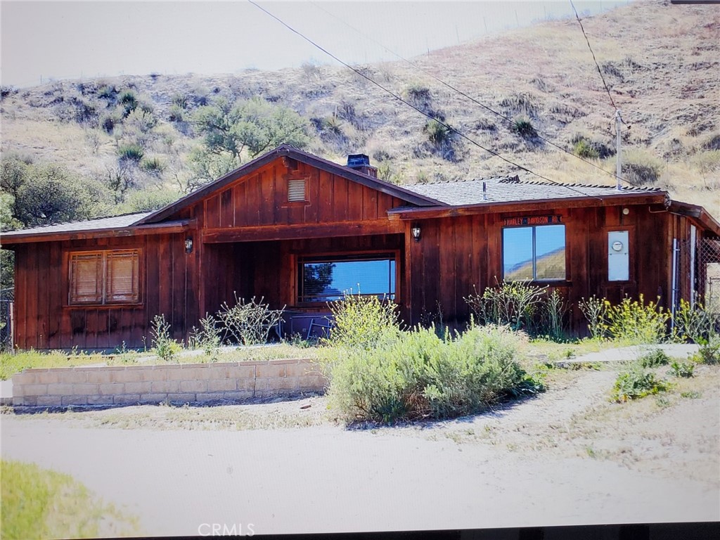 Beautiful In Town horse Property is now available for Lease! When you walk in you're immediately greeted with a spacious high ceiling, and a beautiful stone fire place and huge windows that open the space up. The kitchen was remodeled and has gorgeous counter tops, backsplash. Has built in stove, microwave and dishwasher. Both Bathrooms have been remodeled. The Master bathroom has stunning his and her sinks, and a beautiful glass shower in botticino marble and noche travertine floors. The second bathroom has travertine wainscoting, as well as the shower. The bedrooms are good sized,. The home sits on 2 acres , with a large fenced yard! Horses, chickens, goats, and dogs are welcome.