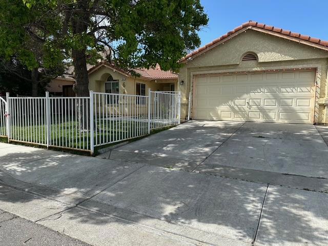 Welcome to this charming home located in the vibrant city of Los Banos. This residence offers a spacious layout with 1,379 sq ft of living space, featuring three bedrooms, including a primary suite with a retreat and walk-in closet. The home boasts two full bathrooms, one with a shower over tub and the other with a stall shower for convenience. The kitchen is well-equipped with modern amenities, including a dishwasher, garbage disposal, and electric oven range. It seamlessly connects to the family room, creating an inviting space for gatherings. Enjoy meals in the cozy breakfast nook or the dining area. This property features beautiful wood flooring throughout, adding warmth and elegance to the home. Stay comfortable year-round with central AC and heating. The living area is complemented by a charming fireplace, perfect for cozy evenings. Additional features include vaulted ceilings, inside laundry facilities, and a two-car garage. This home falls within the Los Banos Unified School District. Dont miss the opportunity to make this wonderful house your new home!