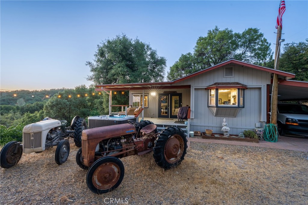 Check out this view! Enjoy the beautiful sunsets every night while overlooking Oakhurst and the Sierras while soaking in your hot tub or having a cold drink on your covered porch. This well maintained 1971 manufactured home has been thoughtfully added on to in 1985. With 4 bedrooms, 2 full bathrooms, including a jacuzzi tub in the primary suite, there is plenty of room for everyone in this 1683 sq ft home. Lots of natural light pours into every room with impressive views from the living room and main bedroom. Recent upgrades include newer mini splits, newer furnace, Rinnai tankless water heater, EPA compliant wood burning stove and large hot tub. A new shop was added on the corner of the property with power ready for you to create a generous sized workshop. Underneath the home there is ample storage space as well for all your tools and toys. Come check out this spacious 5.04 acre lot where there is plenty of space to add an ADU or whatever suits your dreams! Feel like you are on top of the world up here on Taylor Mountain!