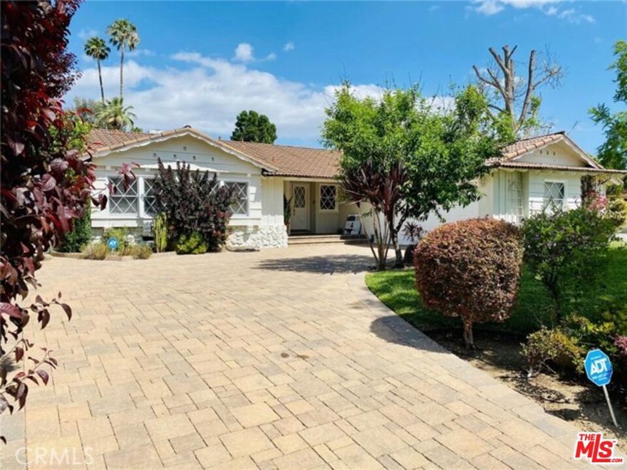 Welcome to this charming traditional home in Woodland Hills, perfectly situated within an award-winning school district, including El Camino Charter High School, Hale Charter Middle School, and Woodlake Elementary.This spacious residence offers 4 bedrooms, 2 bathrooms, and approximately 1,917 sq. ft. of living space on an expansive 10,000 sq. ft. lot. The home boasts a beautifully remodeled kitchen with stainless steel appliances, a double oven, and two fully renovated bathrooms.The large backyard features a sparkling pool, ideal for enjoying California's great weather, with ample space for outdoor dining, entertaining, and family fun.Conveniently located with direct access to the 101 Freeway, this property is just minutes from shopping, dining, hiking trails, and parks. Enjoy easy access to Calabasas, Malibu, and The Village at Woodland Hills, offering the perfect blend of comfort, convenience, and lifestyle.****Fourth bedroom has convereted and it was using as family room, it can be an office or dinning room as well.***