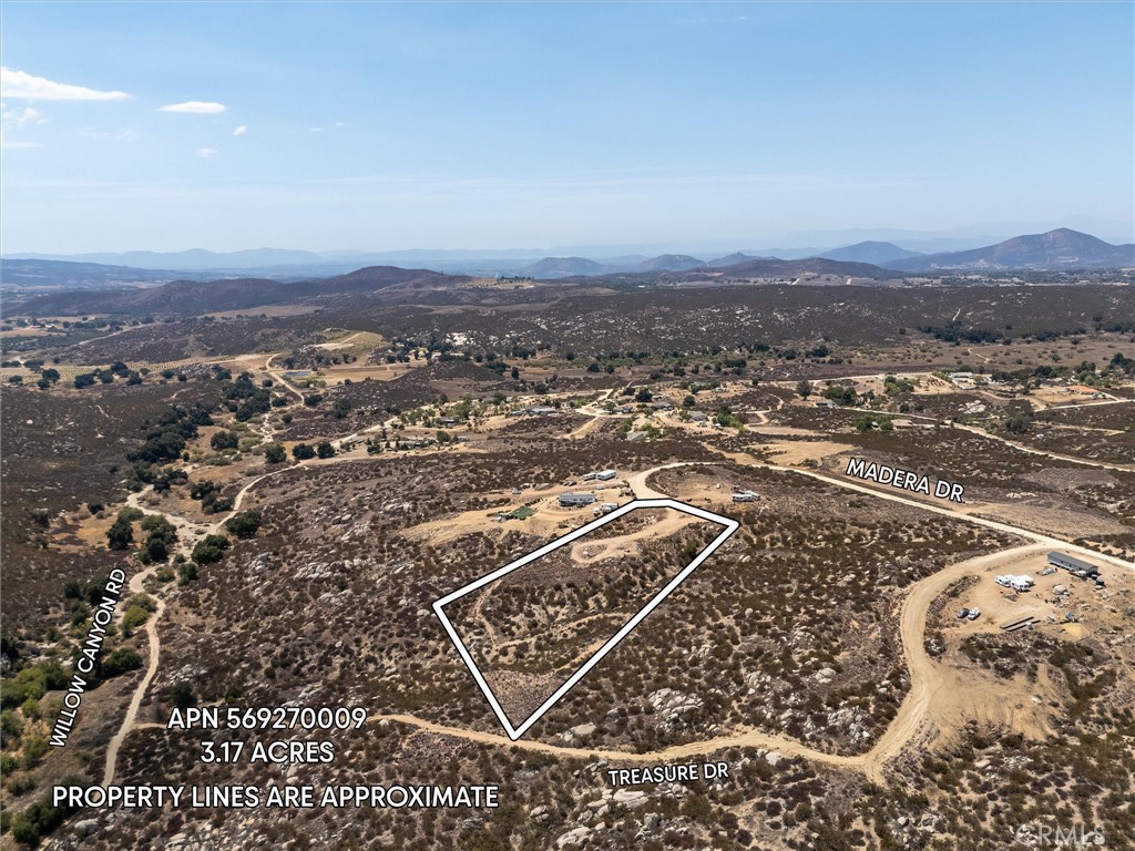 Discover an exceptional opportunity to build your dream home on this spacious 3+ acre parcel, ideally situated in a rapidly expanding community. This property offers a unique blend of privacy and accessibility, making it a highly desirable investment. Access to the lot is remarkably easy, thanks to a well-maintained fire road that ensures smooth entry for construction vehicles and future residents alike. Furthermore, the land boasts two pre-established pads, strategically prepared for potential home sites, significantly reducing initial development costs and accelerating your building timeline. This area is experiencing a robust period of growth, with numerous new homes under construction, indicating a strong and appreciating real estate market. While the convenience of municipal water and sewer services is not yet available, the property is well-suited for traditional rural living, requiring the installation of a private well for water supply and a septic tank for wastewater management—standard practices for homes in this desirable locale.