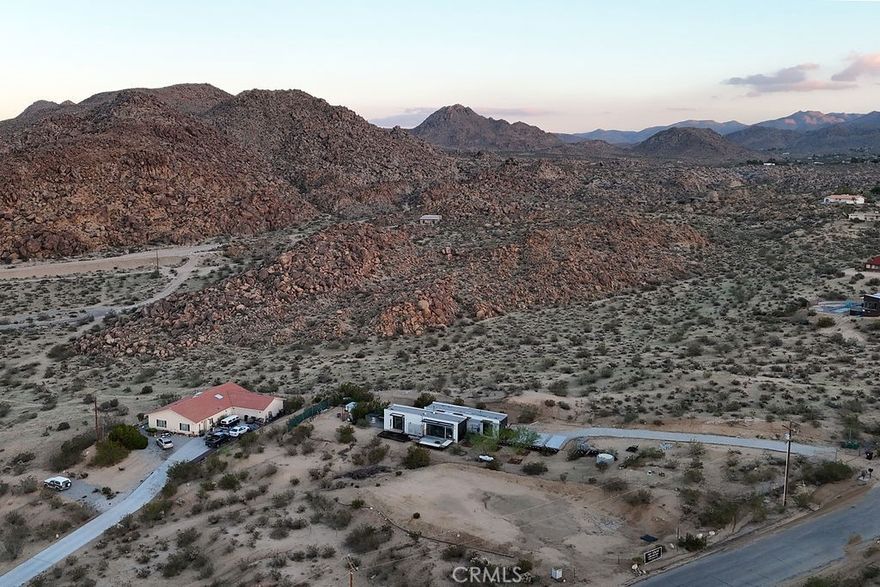Picture this: your very own desert escape just minutes from Joshua Tree National Park. This vision can be yours with 6935 Alturas Dr, a paved road in the Circle Streets, imagine a picturesque 0.41 acre piece of land in Joshua Tree Village, CA, amidst serene surroundings and the breathtaking vistas of the High Desert.



Situated in a prime spot, this property will include paid water service and the land has been graded, approved to place a mobile home on or to build a single family residence upon. Located just a short drive to the entrance of the Joshua Tree National Park, Pioneertown, and Yucca Valley offering easy access to outdoor adventures such as hiking, rock climbing, and stargazing. Just blocks to the nearby town of Joshua Tree provides a vibrant arts scene, eclectic shops, and charming dining options, ensuring you have all the essentials within reach.



Whether you're seeking a peaceful escape or a strategic investment, 6935 Alturas Dr presents a rare opportunity to own a piece of the desert's allure. Embrace all the possibilities and enjoy the tranquility! Don't miss the chance to be part of the Joshua Tree experience and make this piece of land your own.  Buyer to verify and confirm information the agent nor the owners guarantee accuracy of this information.