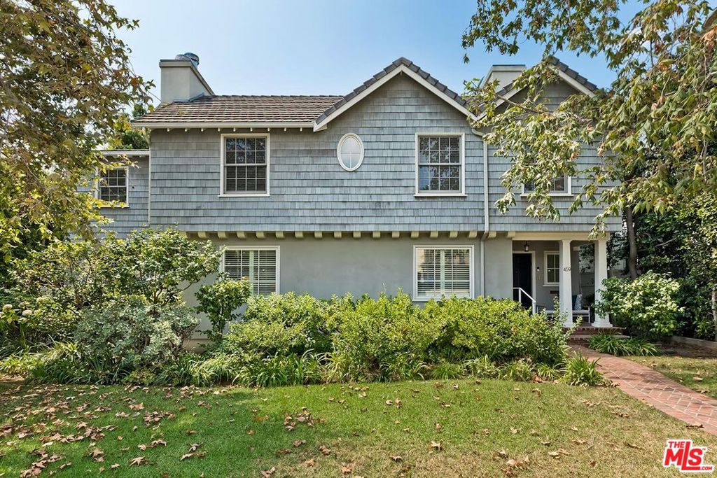 Welcome to 459 South Bentley Avenue, a rare offering in the coveted Westwood Hills neighborhood. Perfectly situated on an expansive oversized flat lot of over 10,700sq. ft., is this stately residence. The home offers almost 4,000 sq. ft. of well-maintained living space, featuring four generously sized bedrooms upstairs and three and a half bathrooms. The spacious primary suite includes a beautiful bathroom and a large walk-in closet. A grand kitchen with soaring ceilings, custom cabinetry, high-end appliances, and an abundance of floor-to-ceiling windows which floods the space with natural light and overlooking the expansive landscaped backyard. Beautiful hardwood floors run throughout the home, enhancing its timeless character and charm. From the street, the home presents with classic curb appeal, highlighted by shingled siding and a commanding presence. The lushly landscaped grounds has mature trees and lush plantings, offering an exceptional opportunity to create a personalized outdoor retreat. Conveniently located near all that the Westside has to offer and located within the highly sought-after Warner Avenue School District. This property is a rare offering.
