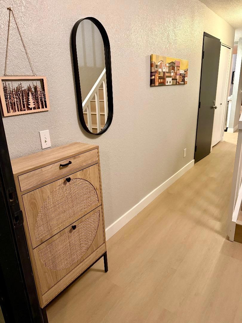 THIS IS THE ONE!! Welcome to a stunning completely updated end unit in a boutique complex in Mountain View, Lucky #7, offering 3 bedrooms and 2 1/2 bathrooms professionally designed with cathedral ceilings. The updated kitchen is a culinary haven equipped with modern amenities such as Stainless steel appliances, an electric range, dishwasher, wine refrigerator, farm sink, beverage station and an island, making meal preparation a breeze. Enjoy the multi-zone cooling and Energy Star HVAC, ensuring comfort throughout the seasons. Start your day at the coffee/beverage station and head back upstairs to your private balcony. Great way to start or end a day with your favorite beverages . Have some friends over to unwind in this lovely private backyard. End your day in your private en-suite retreat complete with fireplace. This unit has plenty of room for a home office for working from home and a separate guest bedroom. The home boasts so many updates including brand new tile flooring in bathrooms and waterproof/scratch resistant wood looking LVP quality materials throughout. This is a must see. The last two 3 bedroom units in this complex sold for $1.5 without updates and $1.8 completely updated. Experience the community this weekend and stop by the SAT Open House for Affogato.