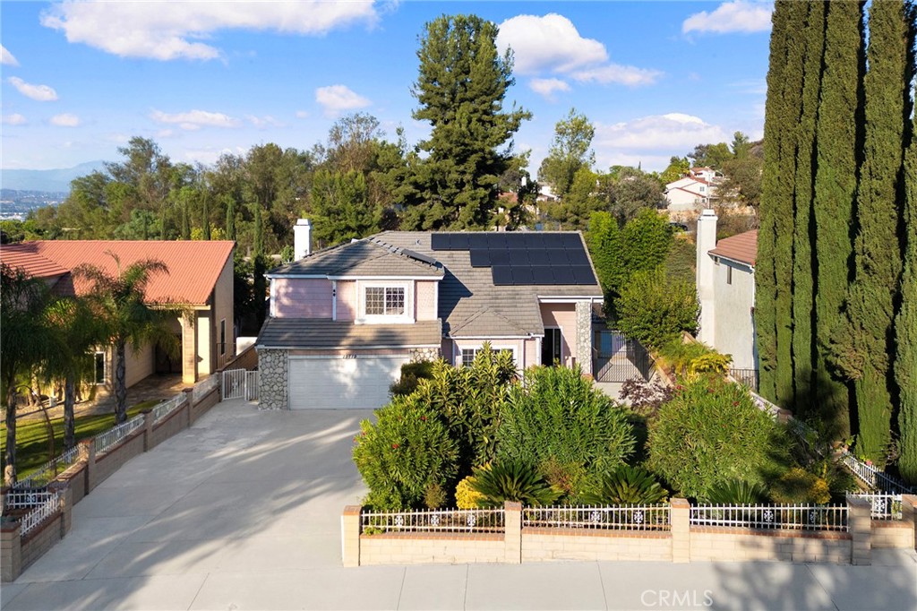 This unique home sits on an expansive 42,784 sqft lot and has been fully renovated with $400K+ in upgrades, offering an exceptional blend of eco-friendly living and modern comfort. The sprawling backyard is a paradise for outdoor lovers, featuring a lush garden filled with fruit trees, fish ponds, an above-ground pool, a basketball hoop, and plenty of space for camping, BBQs, and even raising chickens. The bright, open living area welcomes you with high ceilings and abundant natural light. The newly remodeled kitchen, complete with a breakfast bar, offers beautiful views of the backyard, creating a perfect setting for family meals. The first floor includes a guest bedroom with a full bath, while the second floor boasts a spacious master suite with an upgraded bathroom and walk-in closet. Two additional bedrooms upstairs each come with their own en-suite bathrooms. Leased solar panels help reduce monthly electricity costs, adding to the home’s sustainability features. The dining room opens to the backyard, ideal for relaxation or outdoor entertaining. With a diverse fruit orchard and serene surroundings, this home offers a rare opportunity to enjoy both modern amenities and natural beauty in one perfect setting.