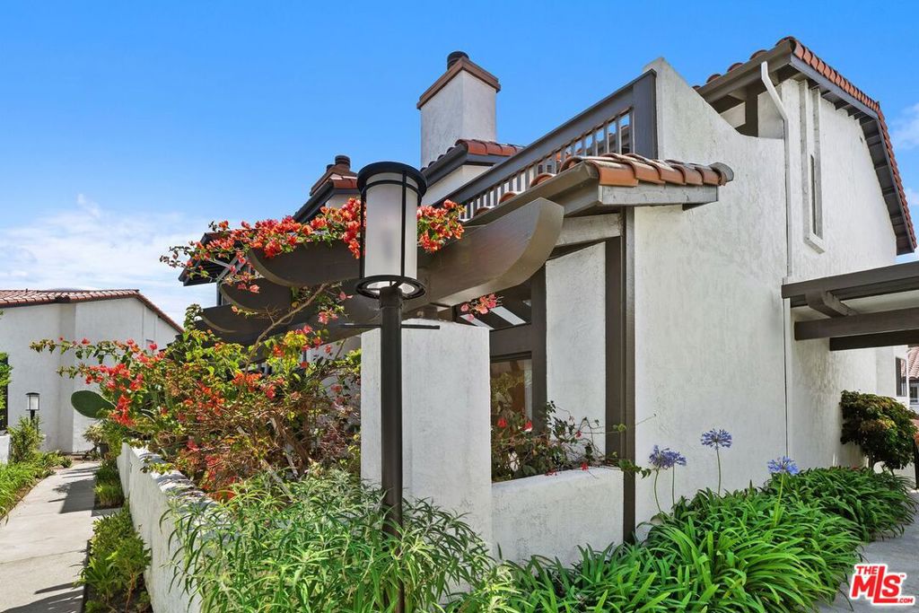 Spacious bright townhouse boasting almost 2,000 square feet with high ceiling with flexible floorplan. New Xtreme Performance flooring throughout, which looks like hardwood but is moisture-resistant and designed to withstand water without damage. New paint throughout including ceilings and cabinets. LED recessed lighting installed near the entrance in the living room, dining area, kitchen and along the staircase leading to the laundry area. The living room with high vaulted ceiling, has a fireplace and opens onto an enclosed patio. There is a spacious dining area, a kitchen which includes a refrigerator, dishwasher, new GE Profile Double Oven and new LG Gas Cooktop and opens to a large breakfast area. There is a 3rd bedroom or Den on the main floor, plus a full bath. Upstairs is the primary bedroom with a huge balcony, large walk in closet and ensuite full bathroom with double sinks. The second bedroom also has a full ensuite bathroom. The rent includes water, a wonderful association pool, spa and gym.