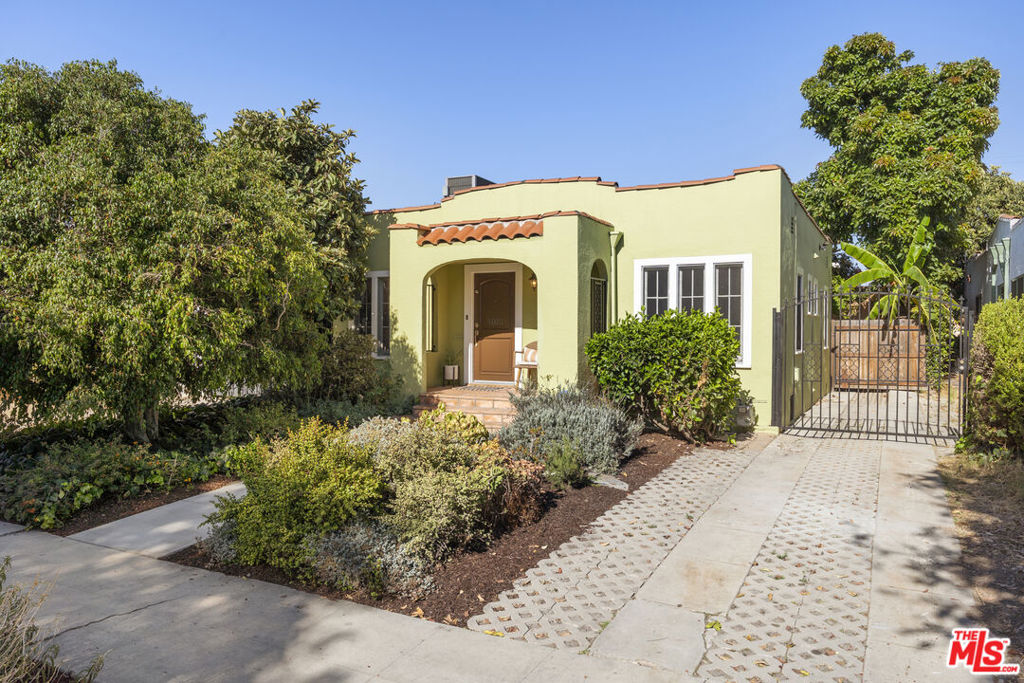Welcome home to this dreamy Spanish charmer in Jefferson Park! This cutie has so much charm and warmth, you won't want to leave it anymore. The lush landscaping in the front yard guides you towards the front steps. As you enter the house, a bright living and dining room awaits. Large original windows throughout bring more charm to this home. With no expenses spared, over the years, a substantial amount of updates have taken place. Highlights of the less visible updates are the sewer line, central air & heating system, emergency backup battery and deployable solar panel, plus earthquake bolting and foundation retrofitting. Besides a very comfortable set-up inside, as you step outside into the private backyard, you'll find a garage that has been converted to a bonus room, with a great set-up for a home office or gym. The mature landscaping provides shade and privacy for this backyard which is perfect for entertaining. Off-street parking is available on the driveway that fits 3 cars. Become part of this great community, with nearby amenities that include Harold & Belle's, Cafe/5, South LA Cafe, Johnny's Pastrami, and Highly Likely as well local parks and stores. Lastly, the location provides easy access to the 10 freeway as well as the Expo Line with great transit options.