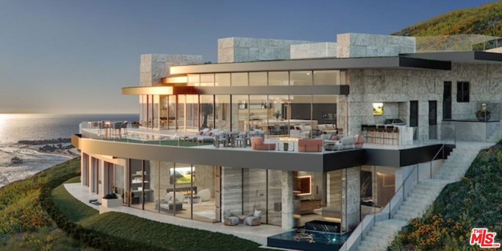 Welcome to Villa Piedra. Indulge in the pinnacle of coastal luxury living at this extraordinary ready-to-build estate site, offering unparalleled, unobstructed 360-degree views of the majestic Pacific Ocean and coastline. Nestled within the prestigious Carbon Beach Terrace Estates, renowned as Malibu's crown jewel of exclusiveestate sites, this prime parcel epitomizes the epitome of coastal opulence. Boasting a coveted location across from the famed Carbon Beach, affectionately known asBillionaire's Beach, and just moments from the iconic Pacific Coast Highway, this unparalleled property invites you into a world of sheer sophistication and elegance.Majestic gates welcome you, unveiling a mesmerizing panorama of endless ocean views that stretch as far as the eye can see. Designed by the esteemed architect JayVanos, this exquisite contemporary architectural masterpiece awaits construction with approved city plans and permits in place, ensuring a seamless transition from visionto reality. Spanning approximately 11,124 square feet, this sprawling residence offers an unparalleled blend of luxury and comfort, with 5 bedrooms, a dedicated office, anda guest wing providing ample space for both relaxation and entertainment. Step inside to discover a wealth of amenities designed to elevate your lifestyle to new heights.From the lavish wine cellar and seated bar to the intimate piano bar and state-of-the-art home theater, every detail has been meticulously crafted to cater to the mostdiscerning tastes. For those seeking rejuvenation and wellness, a fully-equipped gym and sauna/steam room await, while an indoor-outdoor jacuzzi offers the perfectsanctuary for relaxation. Outside, an oasis of serenity awaits, with an infinity pool featuring a wading area, jacuzzi, and outdoor kitchen complete with a pizza oven and builtin BBQ. Double-gated for ultimate privacy and security, the property also boasts ample guest parking, ensuring that every gathering is met with ease and convenience. Setupon approximately 18 acres of pristine coastal landscape, this remarkable property offers a rare opportunity to own a piece of Malibu's most coveted coastline and createthe ultimate retreat to make your coastal dreams a reality.