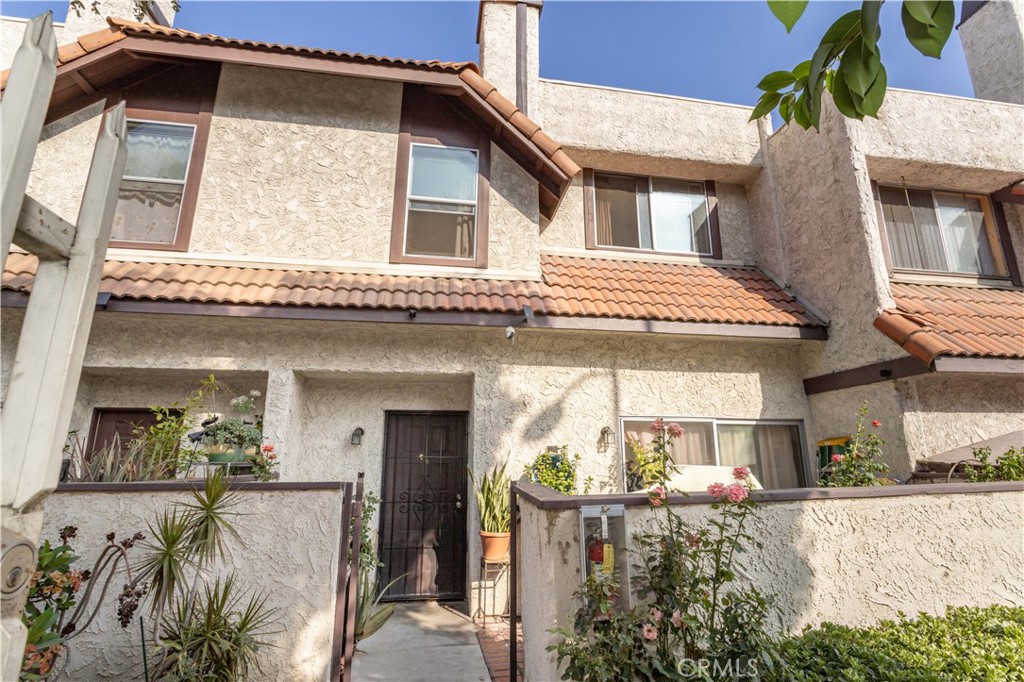 FHA-approved! Perfect starter home 3-bedroom, 2-bath condo with tile floors downstairs and wood laminate upstairs. Light-filled kitchen with granite countertops. Attached 2-car garage with laundry area and private patio. Community offers pool & spa. Conveniently located near Hansen Dam Golf Course, recreation center, parks, schools, and shopping.
