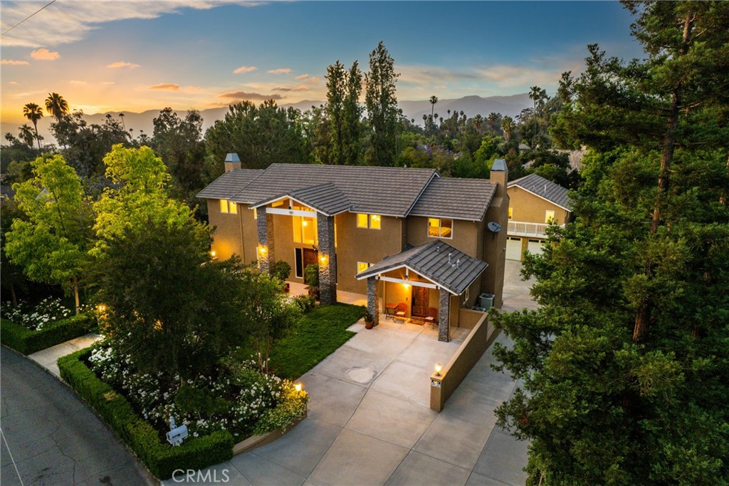 Triple Income Potential! Sprawling 4,685 sq ft Redlands Estate + Detached Guest House + Resort-Style Balcony - Discover a one-of-a-kind property offering luxury living, exceptional income potential, and significant value beyond its square footage. This is not just a home; it’s a private estate designed for multi-generational living, savvy investors, or those who demand space & flexibility. **Your Value-Packed Offering** 3-LEVEL Main House: #1 "Lawyer Level" Private Apartment (Lower Level) >Fully Separate Entrance & optional interior access. >Move-in ready 3-BR, 2-BA, brand-new kitchen, dining, family room & laundry. >Prime Rental Suite or In-Law Haven. #2 "Opera Level" Grand Living (Main Floor) > Sunlit great room w/ soaring ceilings, cozy fireplace & chef’s kitchen (6-burner stove, dual dishwashers, massive island). >Seamless flow to dining + your outdoor entertainer’s paradise! #3 “The Primary Retreat” (Upper Level) >Spa-like bath, cedar closet & balcony access. >Bonus loft (office/reading nook). Crown Jewel: The Expansive View Balcony (284 sqft, Not incl. in Main sqft). Detached Guest House/ADU (969 sqft, not incl. in Main sqft. or price) >Private 1-BR, 1-BA w/kitchenette. >Located above the massive garage (not incl. in main sqft) >Ideal for guests, studio, or high-value rental income. Other Features: Your Private Resort Deck w/hot & cold water sink, built-in barbecue, prep station, and ample seating. Breathtaking Views - enjoy morning coffee or sunset dinners overlooking partial city lights & mature trees & lush foliage. Perfect Flow - directly accessible from the main living area, connected via stairs to the lower yard, and ideal for gatherings. (This premium outdoor living space adds immense value but is not incl. in the main home's sqft.) Unmatched Parking & Grounds - 6-CAR GARAGE & DEDICATED RV PARKING. Expansive driveway for abundant overflow parking. Grassy play areas, fruit trees & serene patios. Why It's A Great Value: You Pay for 4,685 sq ft - But Receive So Much More: an ADU, a huge garage, and a luxurious balcony (+ other balconies)! These premium features are not reflected in the main home's sqft or price/sqft calculation. This is an extra value gifted with the property. Triple Revenue Streams - Potential to rent BOTH the Lawyer Level apartment and the detached ADU simultaneously. This is a LEGACY property offering rare flexibility, income potential, and lifestyle – all within Redlands' coveted charm. The extras alone redefine value.