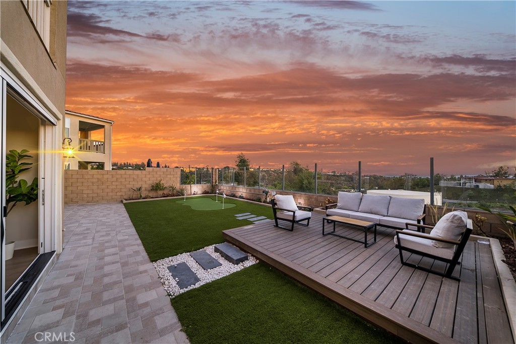 View! View! View! Stunning 5-Bedroom home with city/mountain views in Lake Forest’s Serrano Summit! Solar fully paid off! Welcome to this luxury 5-bedroom, 4.5-bathroom single-family home nestled in the highly sought-after Serrano Summit community in Lake Forest. Built in 2022, this contemporary residence offers the perfect blend of style, comfort, and functionality, with 3500+ sqft of open-concept living space and a 2-car garage plus driveway.
Step inside to an open floor plan featuring a spacious great room and a modern gourmet kitchen with an oversized island, built-in GE Profile refrigerator, and walk-in pantry for abundant storage. A permitted enclosed California room extends your living space seamlessly to the huge backyard, where you’ll enjoy breathtaking mountain and sunset views—perfect for entertaining or relaxing. The home features one bedroom with a full bath on the main level, ideal for guests or multigenerational living. Upstairs, you’ll find four additional bedrooms, including a luxurious primary suite with a spa-inspired en-suite bathroom, private balcony, and spectacular panoramic mountain and sunset views. On the third floor, a versatile bonus room with its own balcony and half bath offers endless possibilities—home theater, game room, or home office.
Residents of Serrano Summit enjoy world-class amenities, including a resort-style pool and spa, BBQ and picnic areas, pickleball courts, pool table, firepit lounges, and more—all designed to capture stunning sunset views. Located within walking distance to the Lake Forest Civic Center and just minutes from shopping, dining, and top-rated schools, this home offers the ultimate Southern California lifestyle.
Don’t miss your chance to own this modern retreat in one of Orange County’s most desirable communities!
