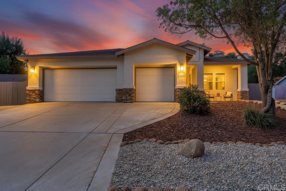Welcome to this beautifully remodeled single-story home in the highly sought-after San Diego Country Estates. Set on a spacious nearly half acre lot, this 4-bedroom, 2.5-bath residence combines modern upgrades with the charm of country living. The open-concept design is filled with natural light and soaring vaulted ceilings. The living and dining area flow seamlessly into the family room and kitchen, showcasing a large center island, quartz countertops, and stainless steel appliances. The kitchen opens to the family room where a stylish modern tiled fireplace creates the perfect gathering spot. A wide hallway leads to four spacious bedrooms, including a private primary suite with a fully renovated spa-inspired bath featuring a freestanding soaking tub, quartz dual-sink vanity, and walk-in shower. Additional highlights include new windows & sliding doors, fresh interior & exterior paint, luxury vinyl plank flooring with oversized baseboards, inside laundry room, 3-car garage, RV parking and an expansive backyard—ready to be transformed into your dream outdoor oasis! Life in Ramona’s San Diego Country Estates (SDCE) means more than just a home—it’s a lifestyle. Enjoy resort-style amenities including a clubhouse with restaurant and sports bar, boutique hotel, golf course, equestrian center, tennis and pickleball courts, dog park, playgrounds, BBQ areas, community pools and spas, miles of scenic trails, plus a 5-acre park with pool, bandstand, and picnic spaces for community events. This home has it all—modern comfort, room to grow, and a vibrant community lifestyle.