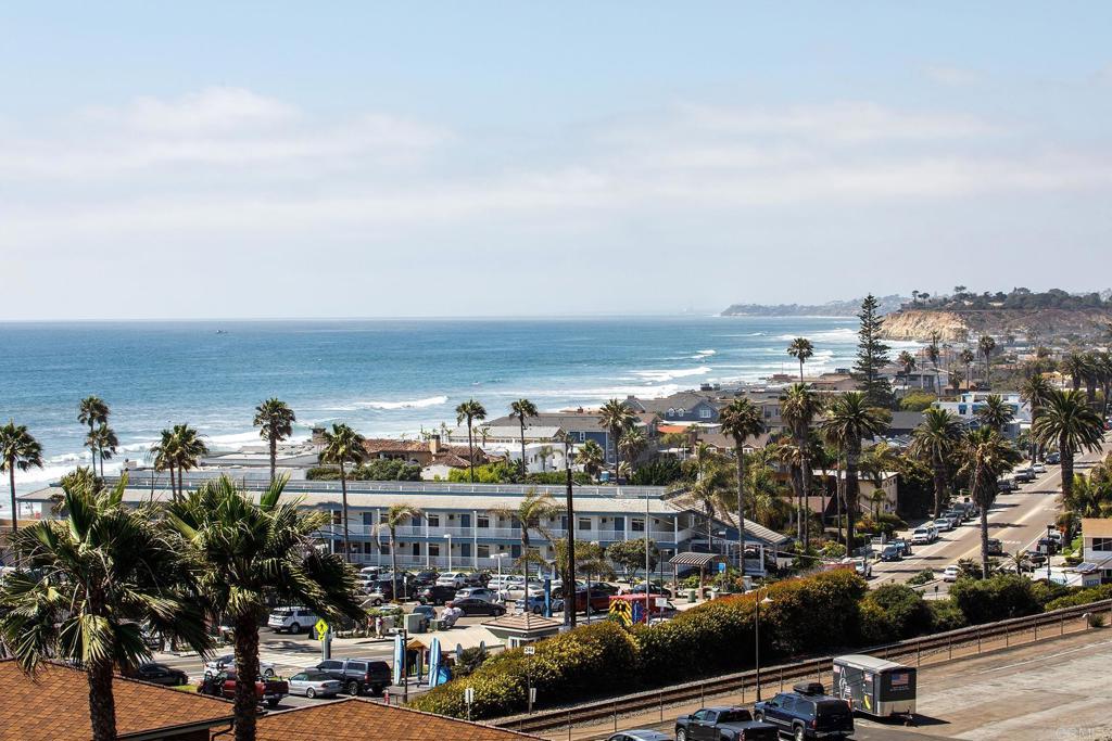 California Dreaming! Race to secure this spectacular Del Mar Beach Colony rental, offering breathtaking Pacific Ocean whitewater and coastline views! This top-floor unit features 1 bedroom (king bed), 2 bathrooms, and a comfortable sleeper sofa. The chef’s kitchen, upscale finishes, and stylish furnishings create an inviting atmosphere, complemented by 3 TVs and an ocean-view balcony off the living room. One of the few units with A/C, it also boasts an interior washer/dryer, a main bath with a walk-in shower, and dual vanity sinks. Enjoy a premier location nestled between the beach, Powerhouse Park, and the luxurious L'Auberge Del Mar Resort. As a tenant, you’ll have access to the Resort's amenities, including a heated pool, jacuzzi, tennis courts, and a fitness center. Parking is a breeze with 3 spaces—1 reserved underground and 2 exterior. This unbeatable location places you just steps from the village, park, beach, and ocean. Available for short-term rentals with a one-month minimum. Rates vary by season. Call Cheri for more details!